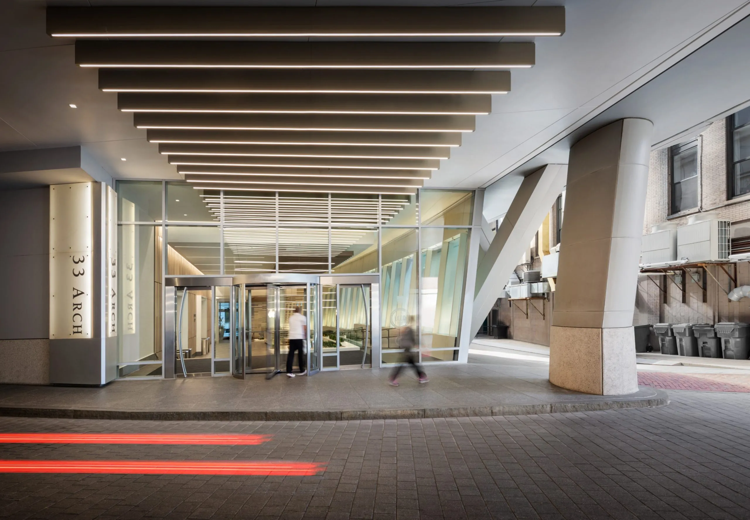 Covered private road with entryway to office building