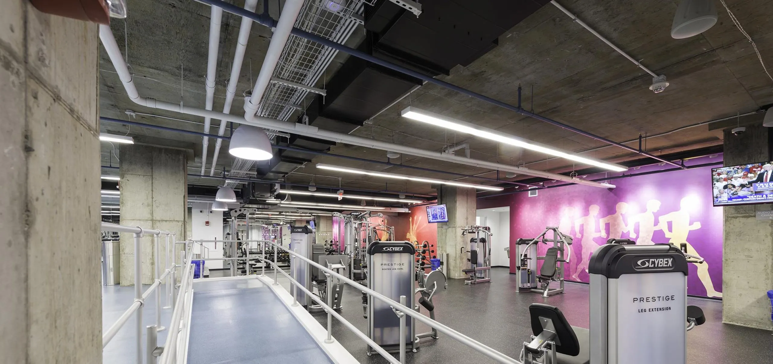 Exercise equipment inside apartment building gym at 75-101 Federal street