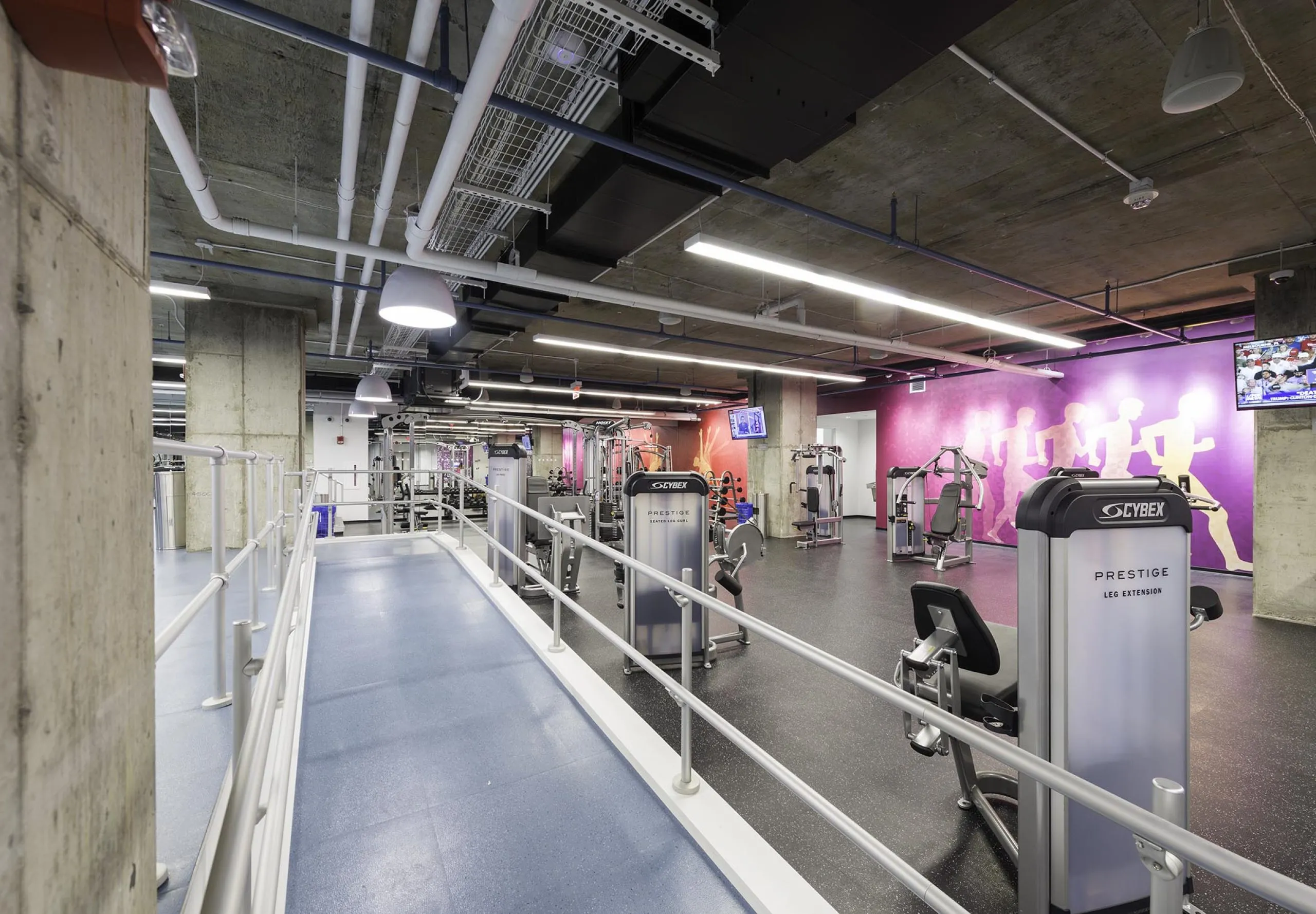 Exercise equipment inside apartment building gym at 75-101 Federal street