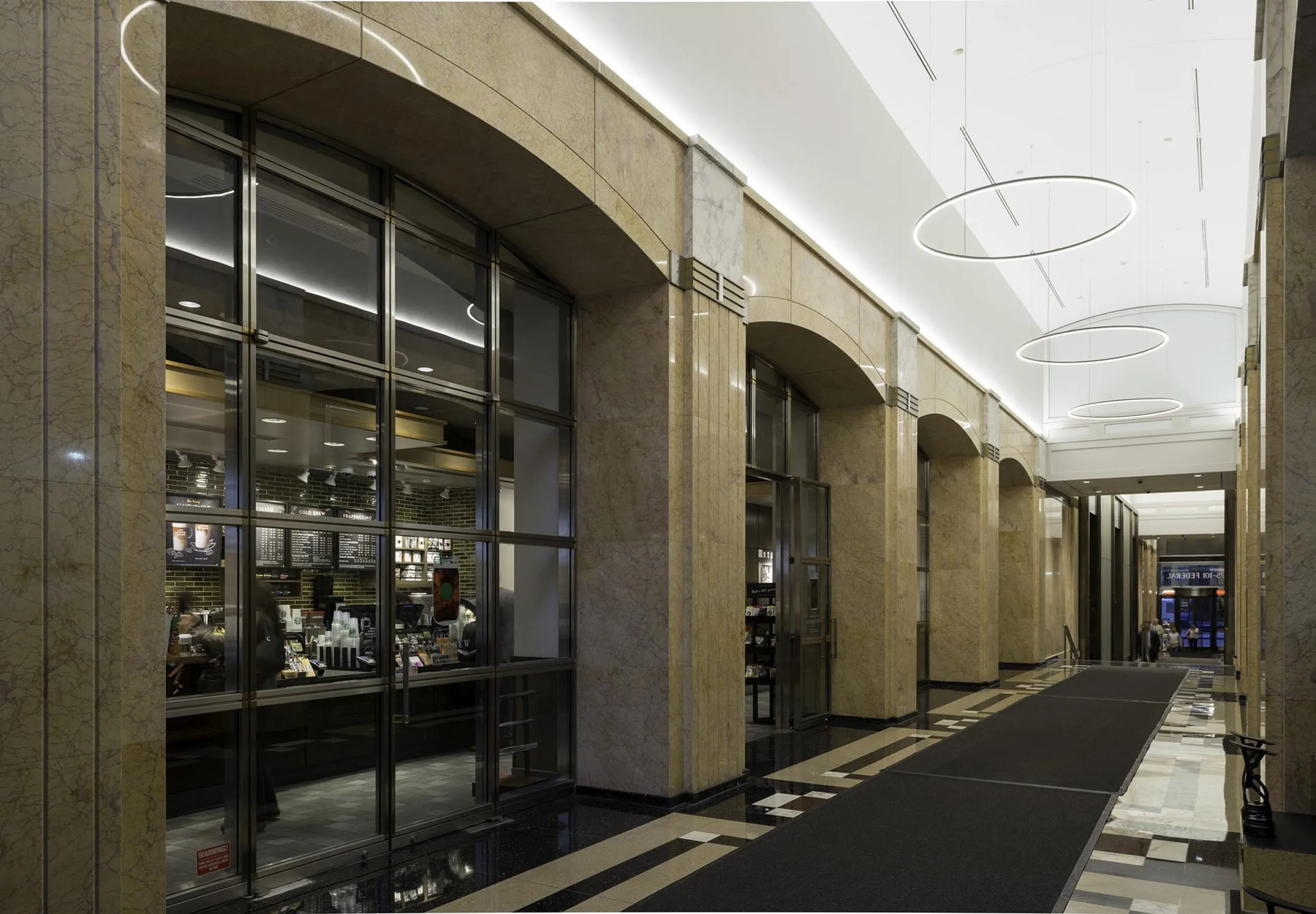 Exterior view of Starbucks coffee shop inside apartment building