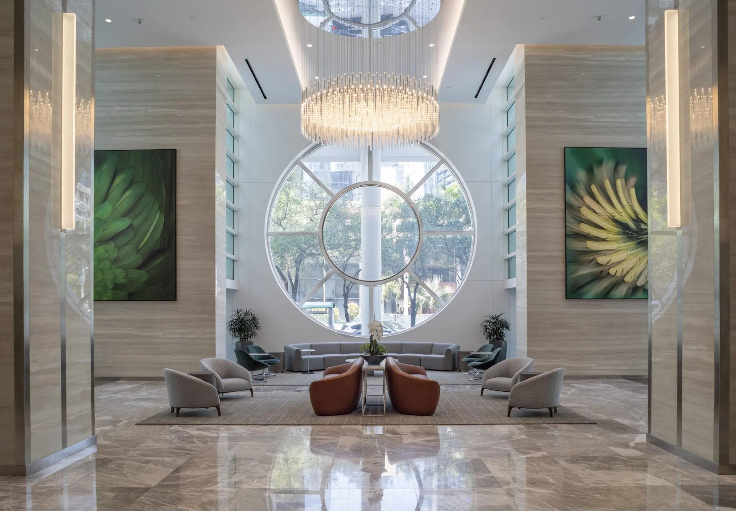 Modern upscale lobby with seating and large chandelier at 801 Brickell