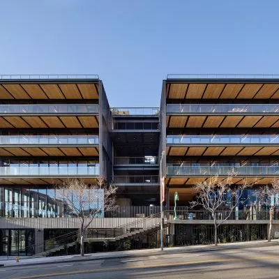 Exterior view of multistory balconies on large modern timber office building at 843 N Spring Street