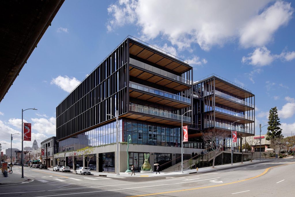 Exterior view of multistory balconies on large modern timber office building at 843 N Spring Street