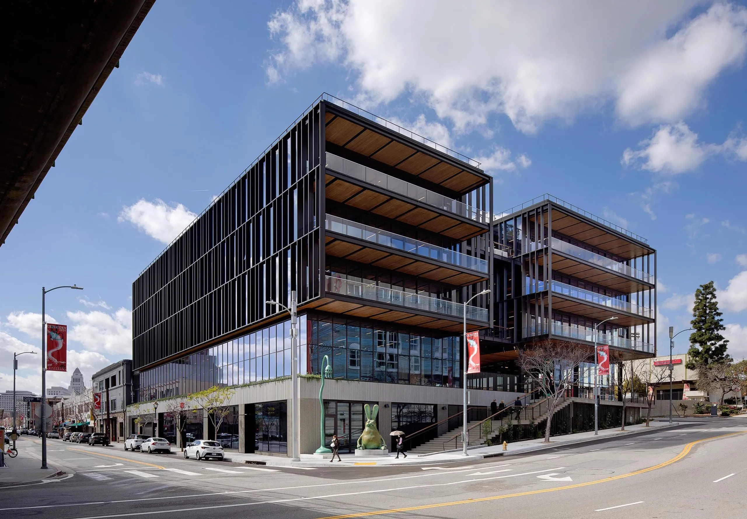 Exterior view of multistory balconies on large modern timber office building at 843 N Spring Street