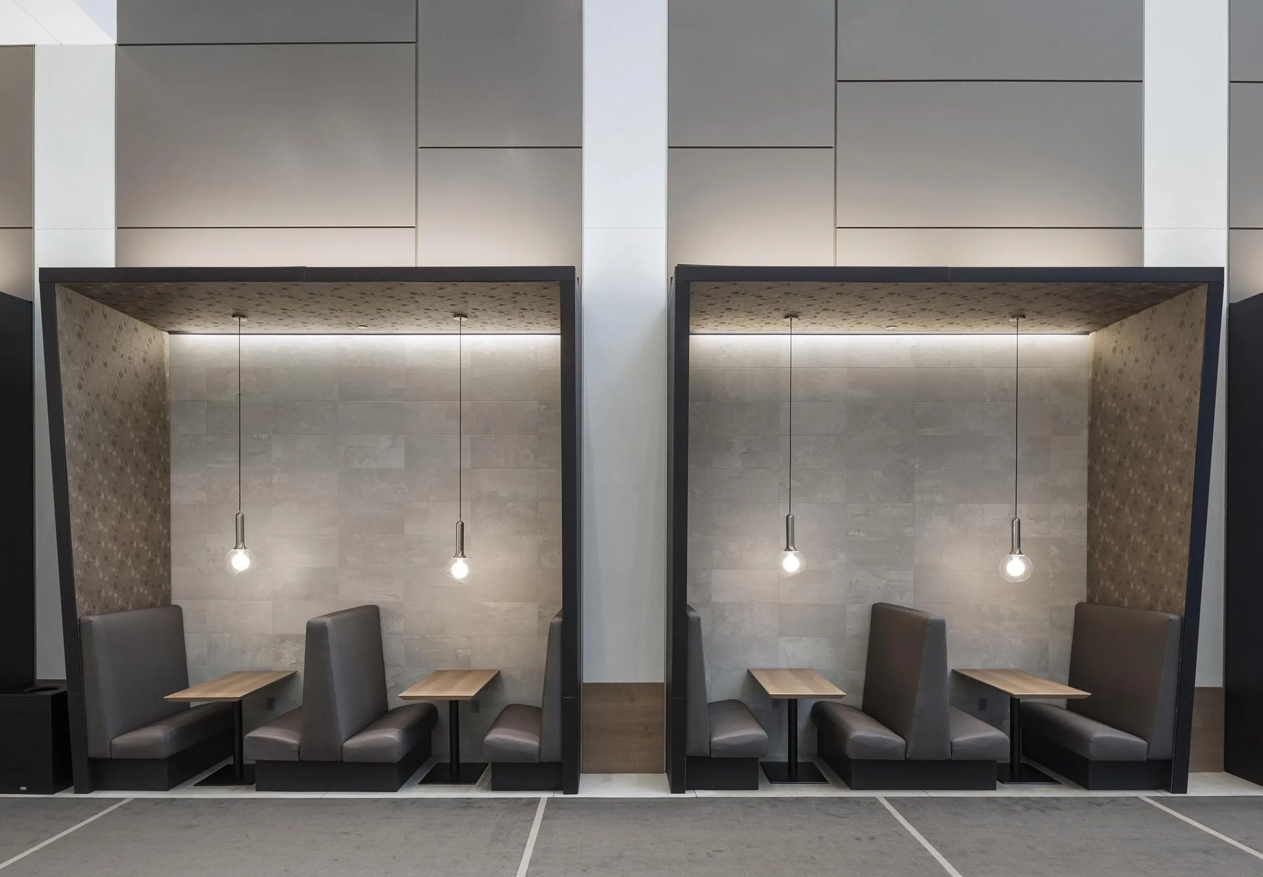 Booths with dining tables in office building