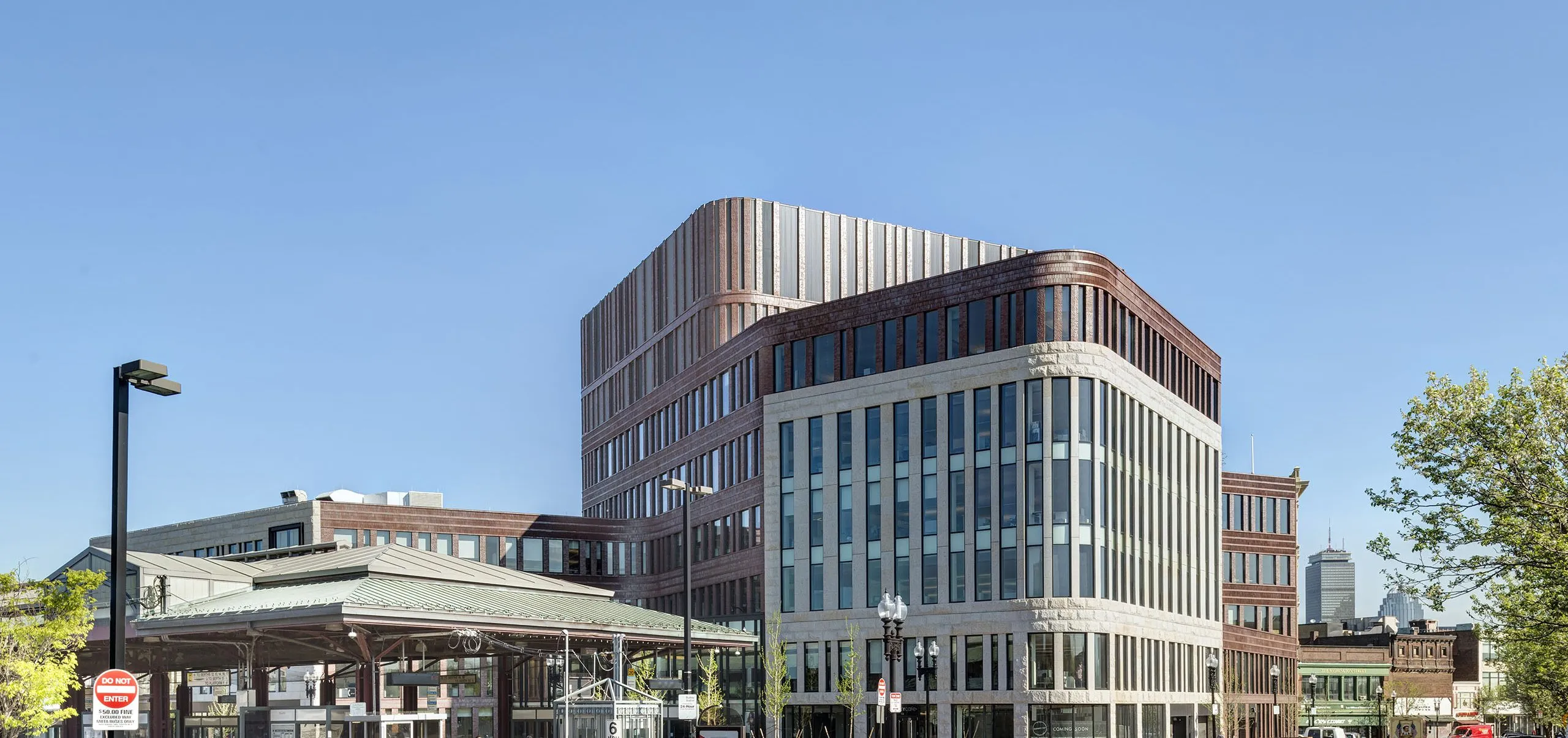 People walking around exterior of building