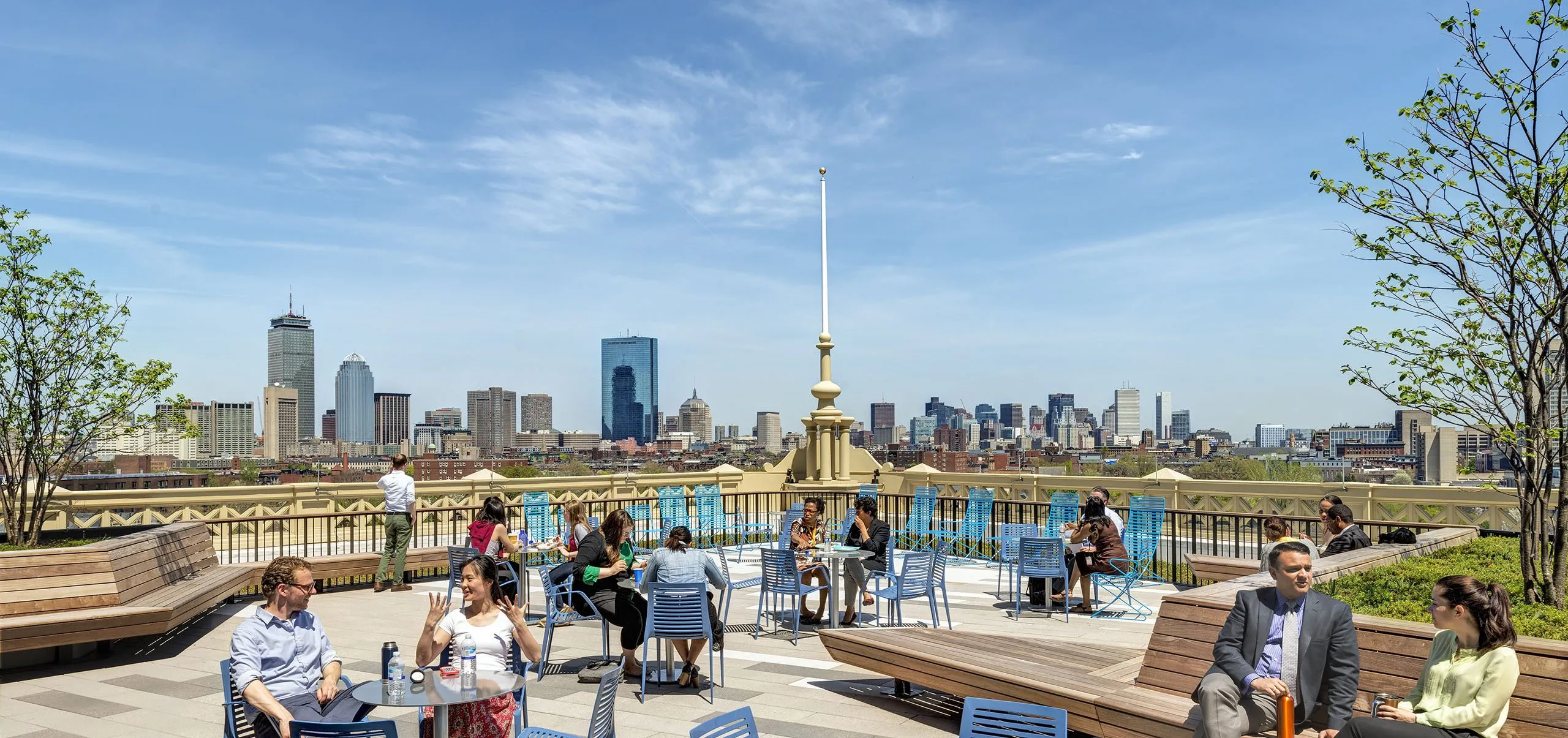 Outdoor seating area with city skyline visible in background