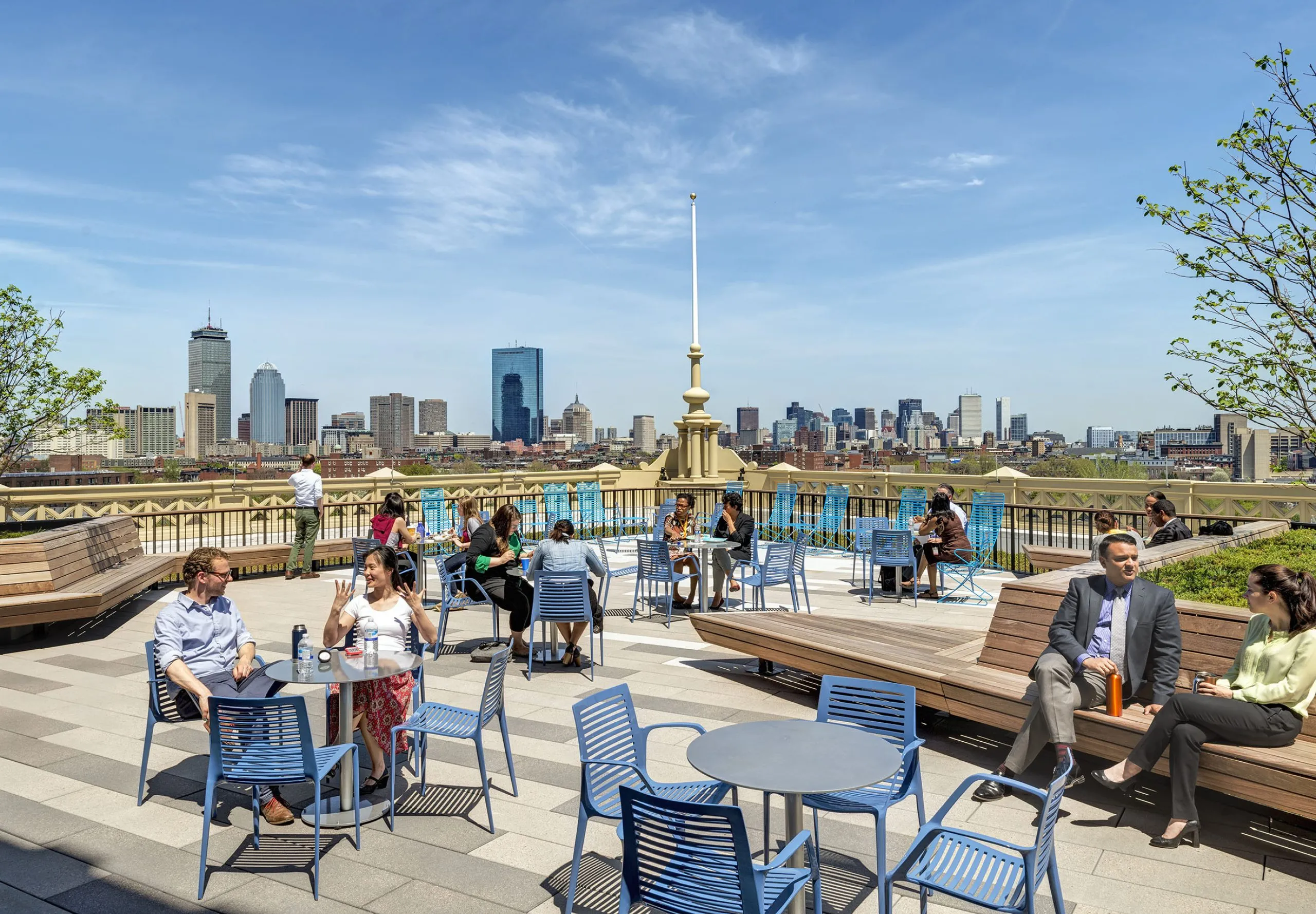 Outdoor seating area with city skyline visible in background