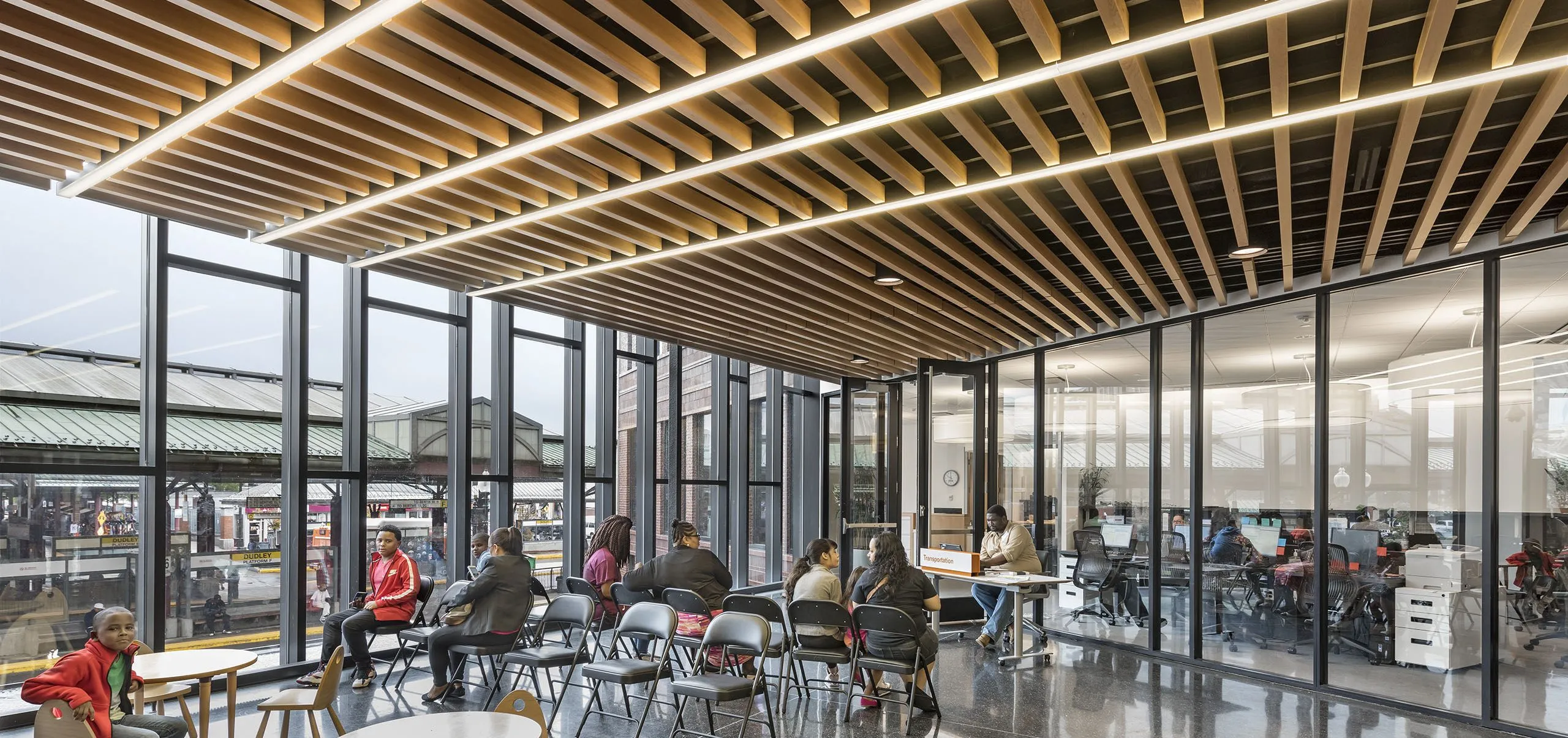 People sitting in waiting area in building