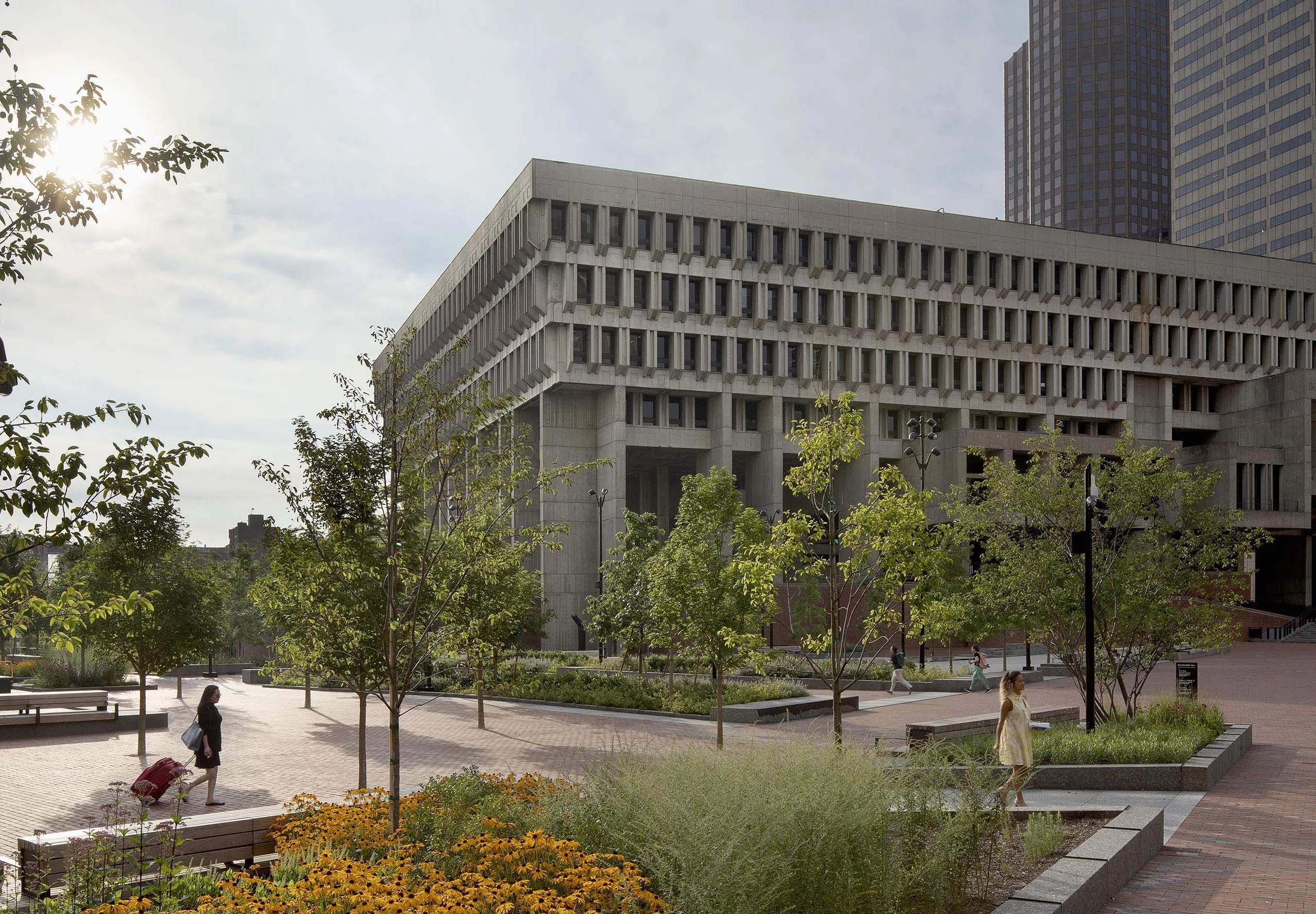 Garden and walking area on exterior of Boston City Hall building with brutalist architecture