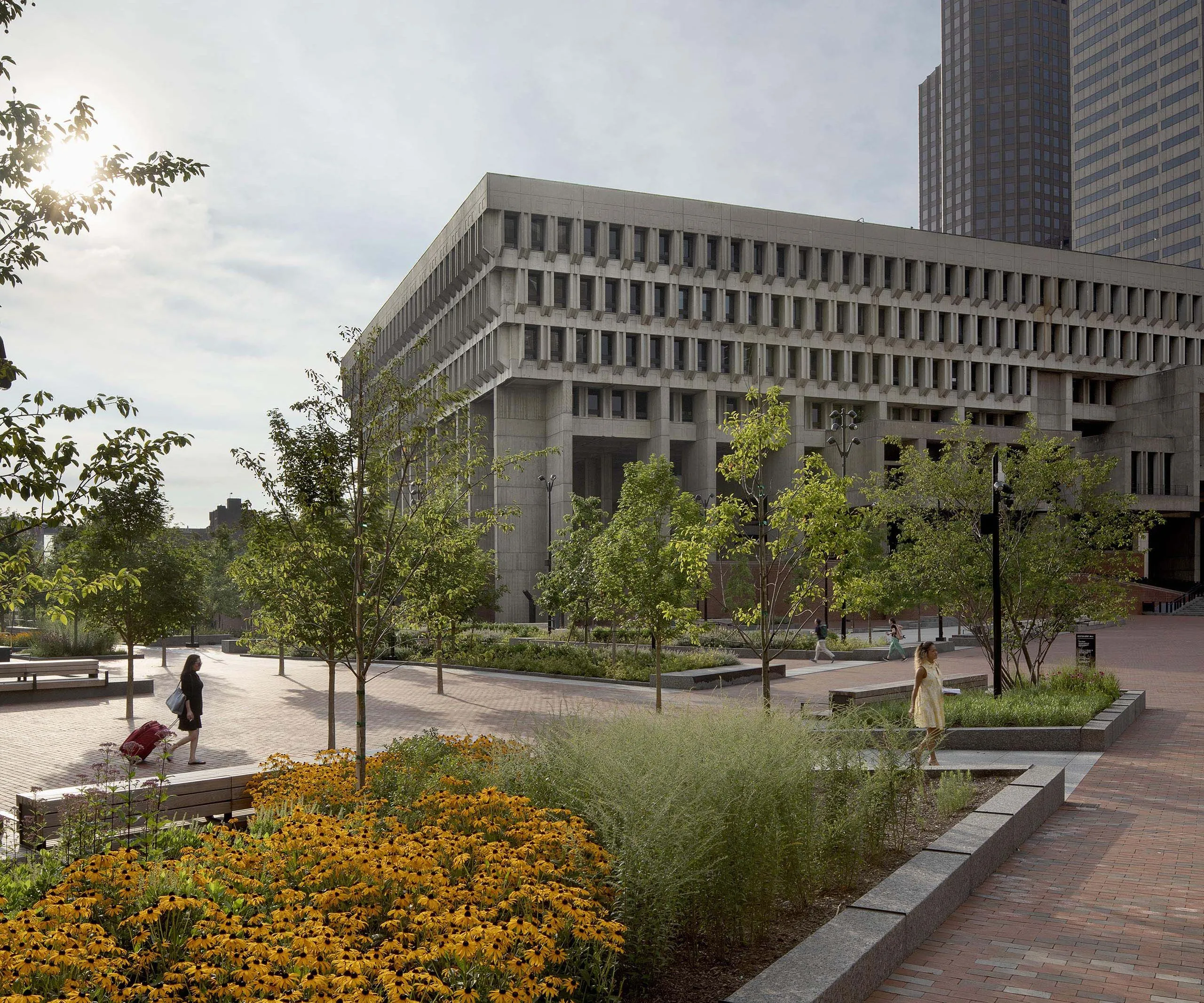 Garden and walking area on exterior of Boston City Hall building with brutalist architecture