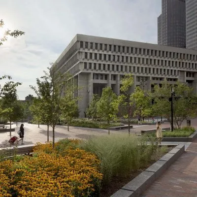 Garden and walking area on exterior of Boston City Hall building with brutalist architecture