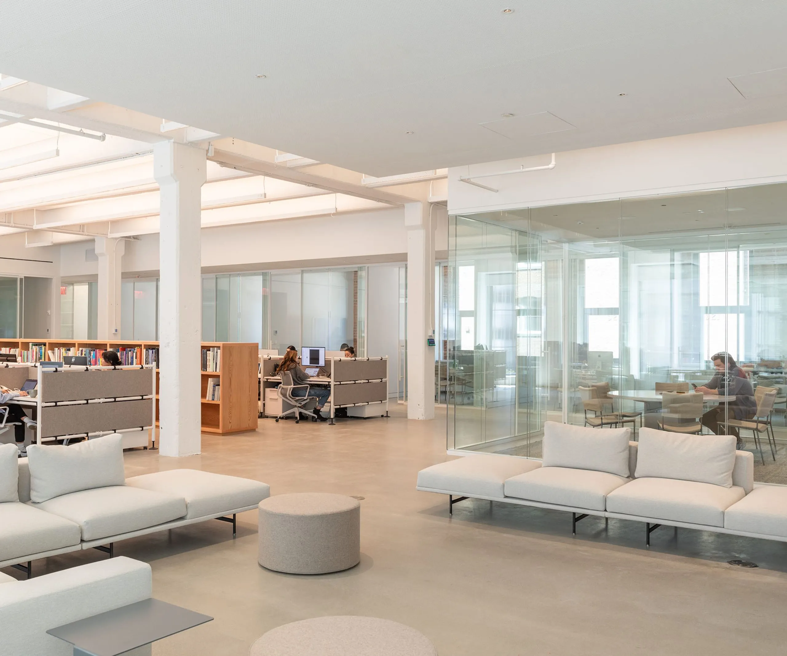 People working in office area and seating area at David Zwirner Headquarters