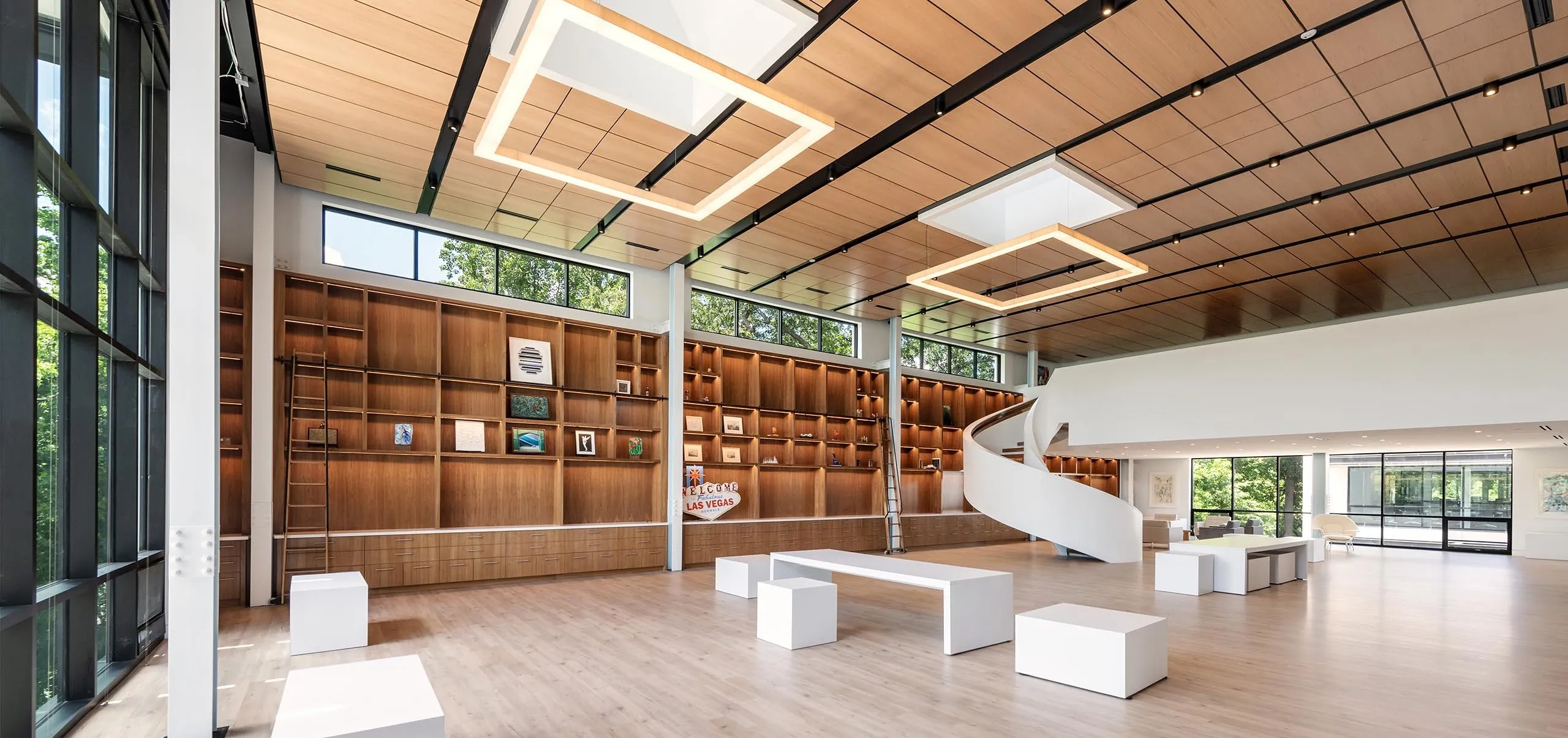 Large bookshelves and seating area in modern HMTX Headquarters