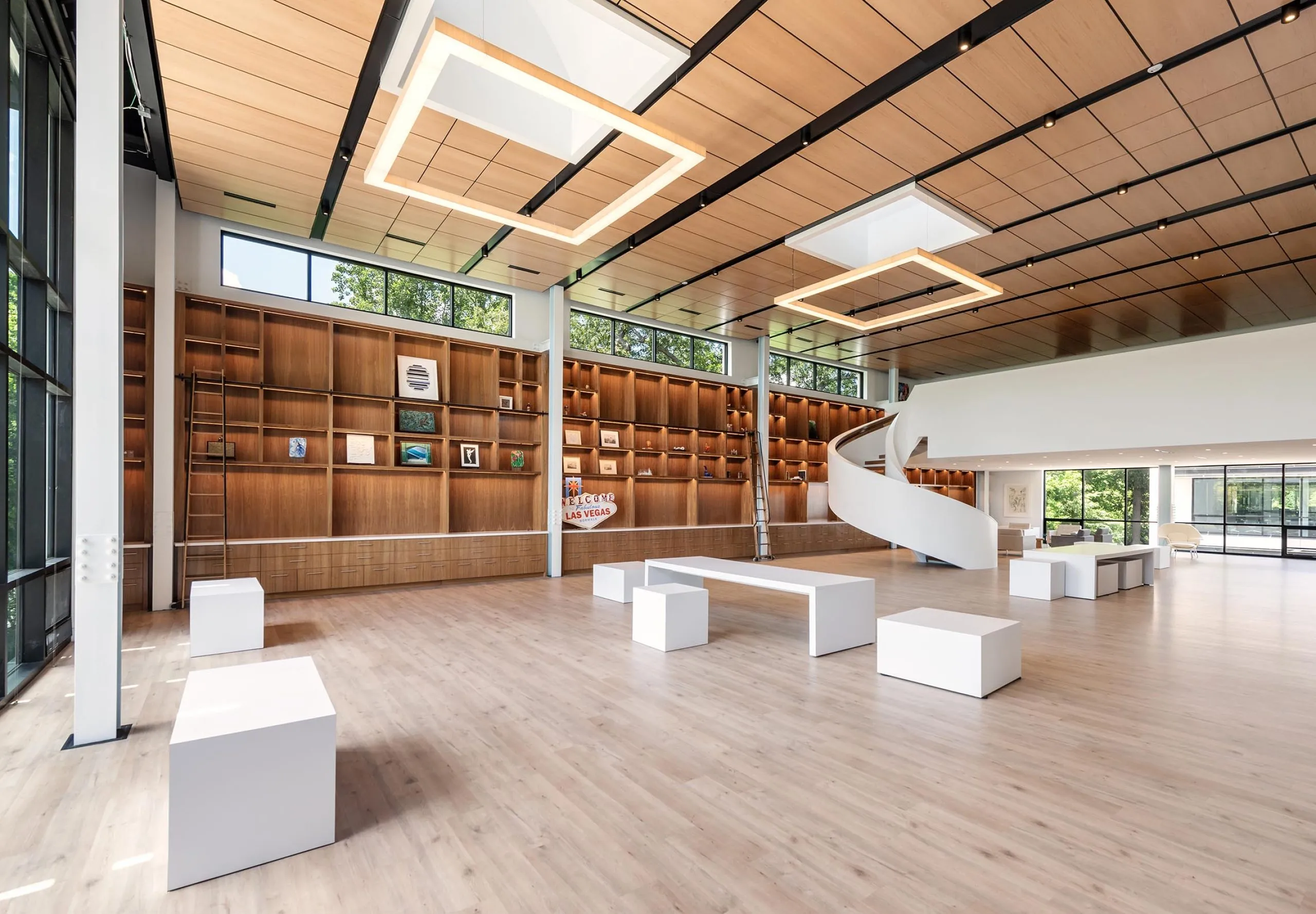 Large bookshelves and seating area in modern HMTX Headquarters