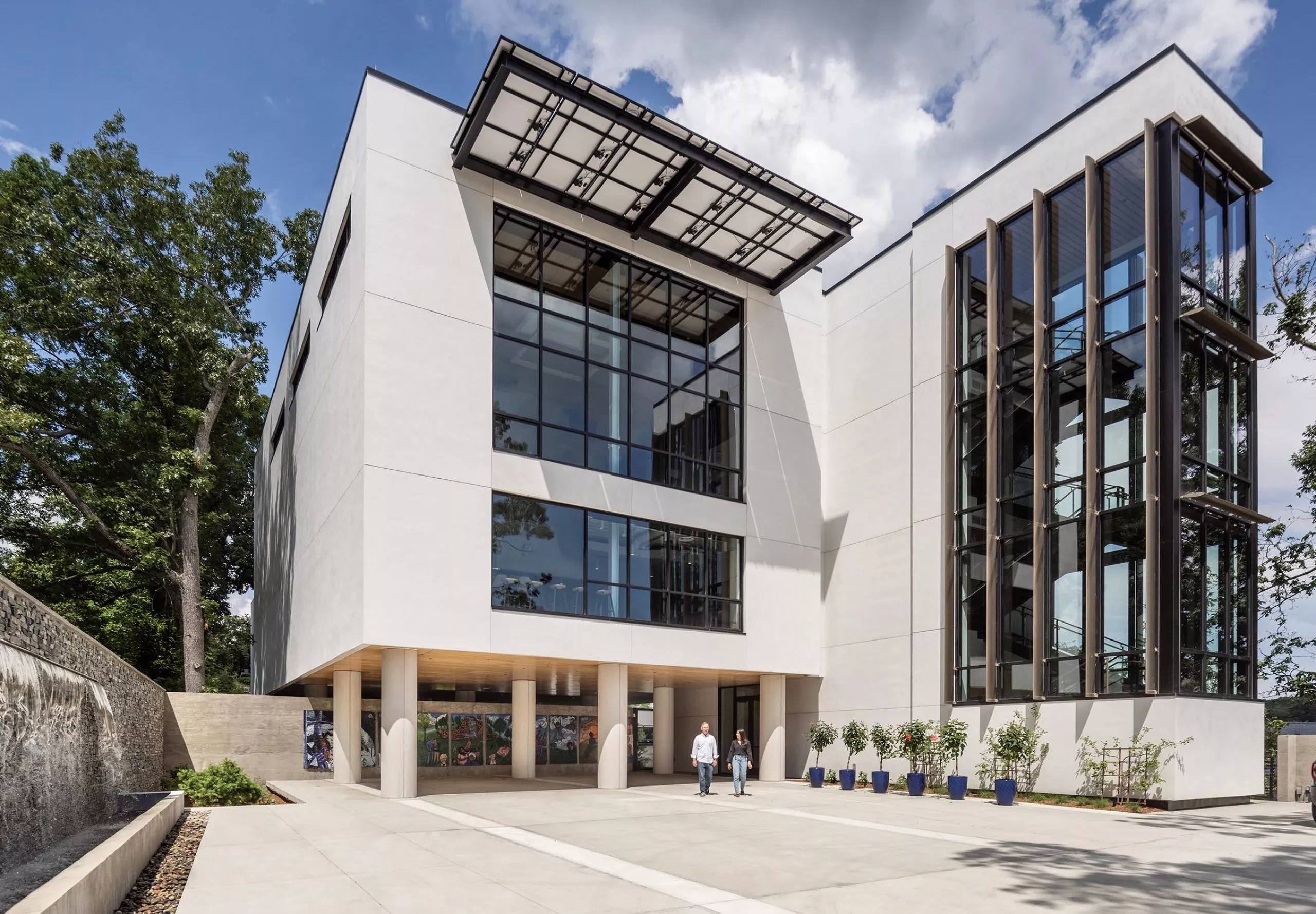 Exterior street view of modern four story office building HMTX Headquarters