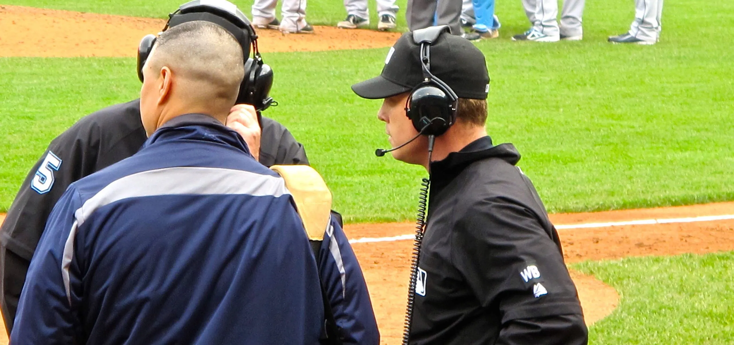 Baseball umpires reviewing a call for MLB Instant replay