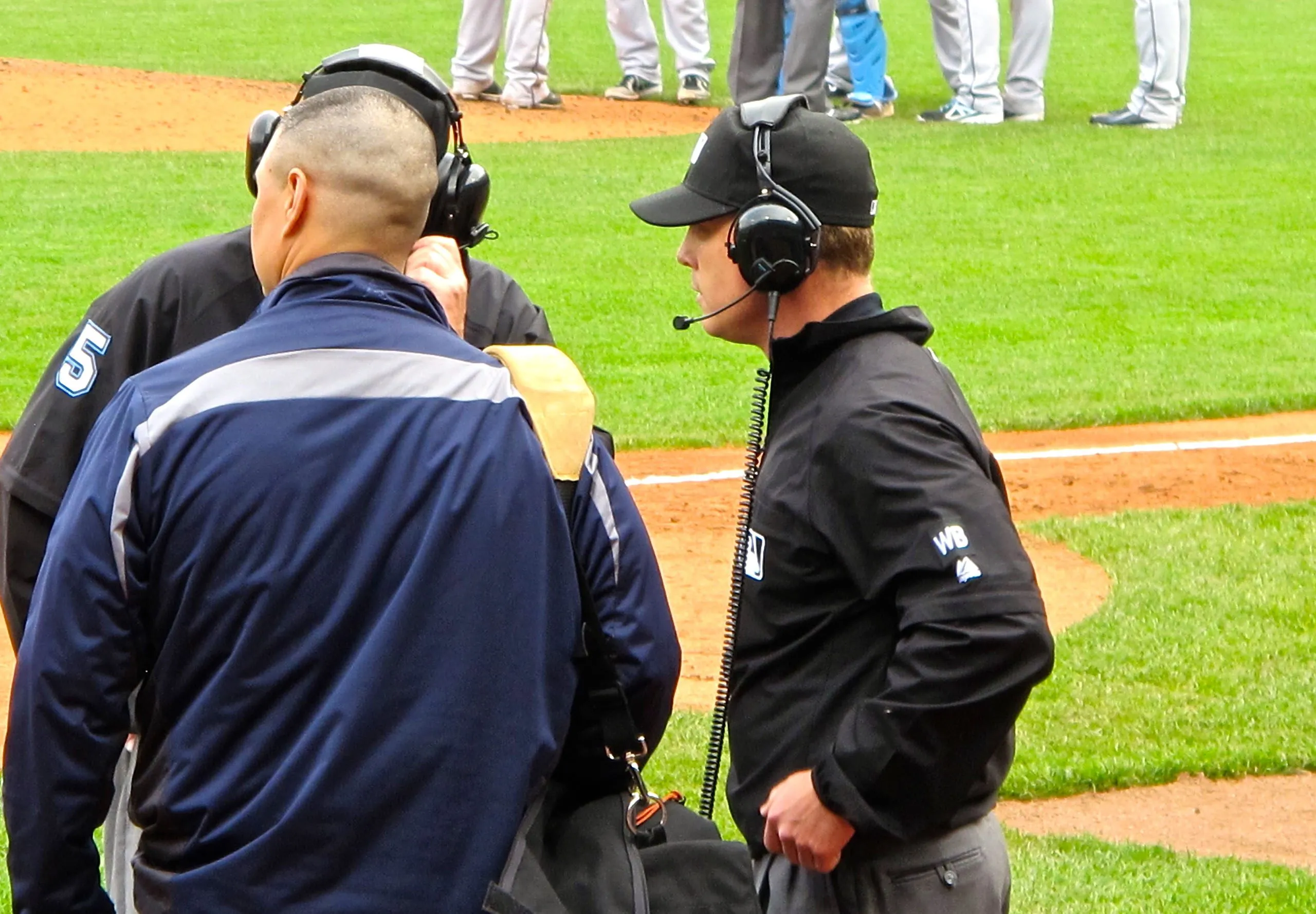 Baseball umpires reviewing a call for MLB Instant replay