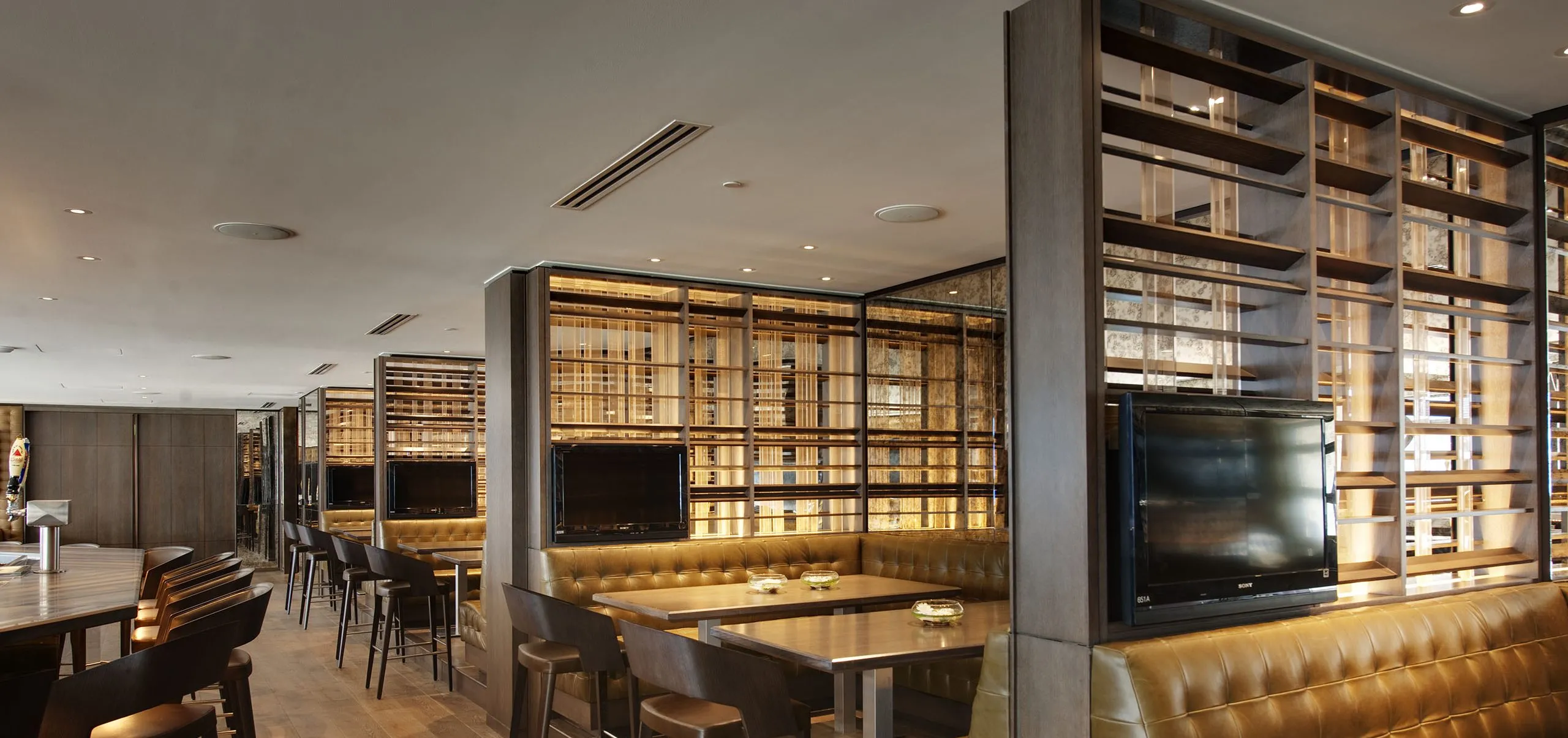 Large booths and bar at MetLife Stadium Jet's Team Room