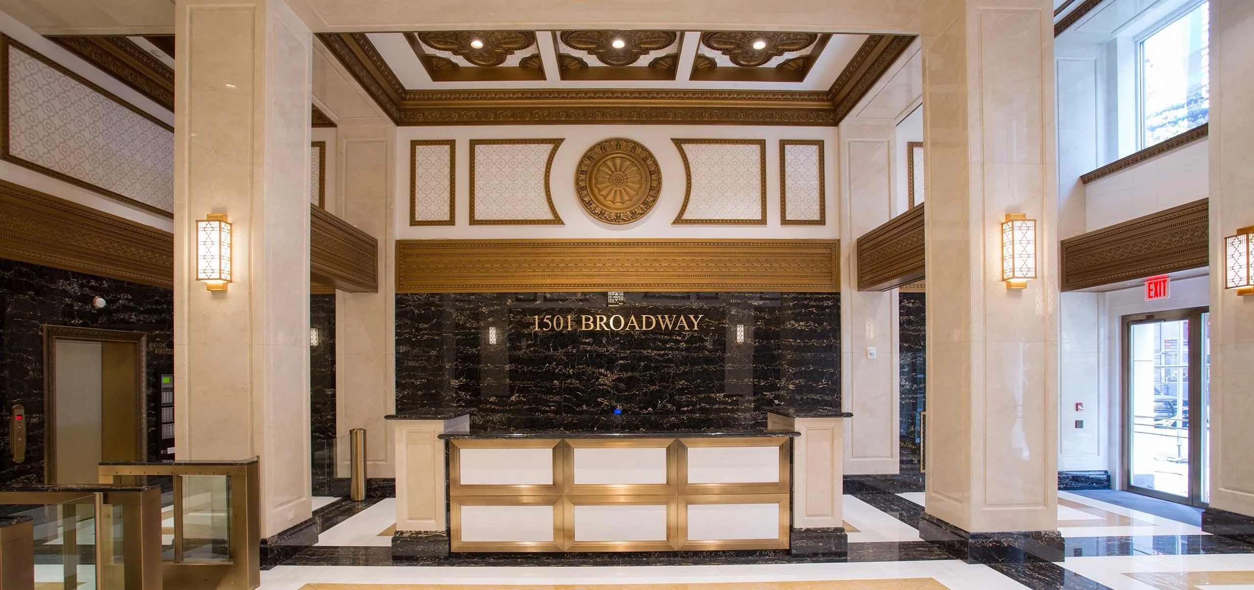 Front desk with golden accents at Paramount Building