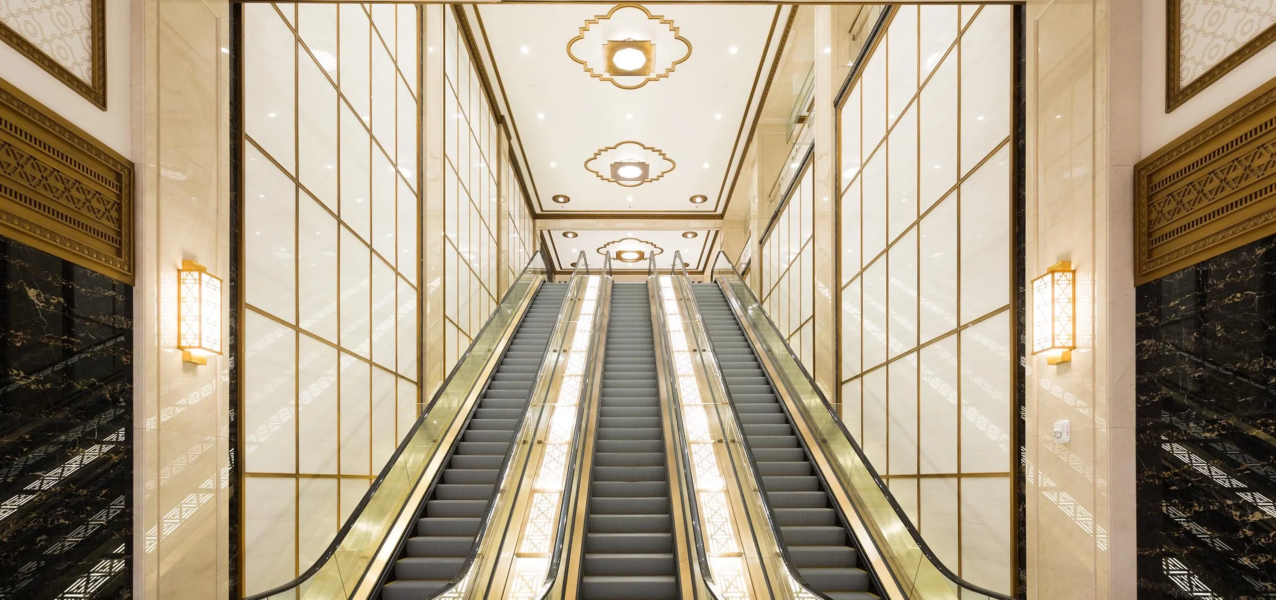 Escalators with golden accents at Paramount Building