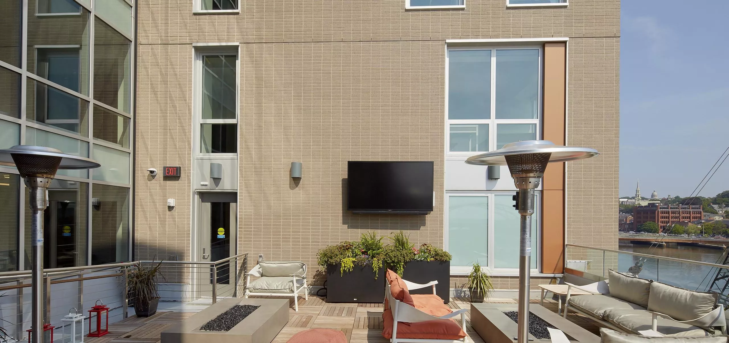 Balcony and outdoor seating area at River House Apartments