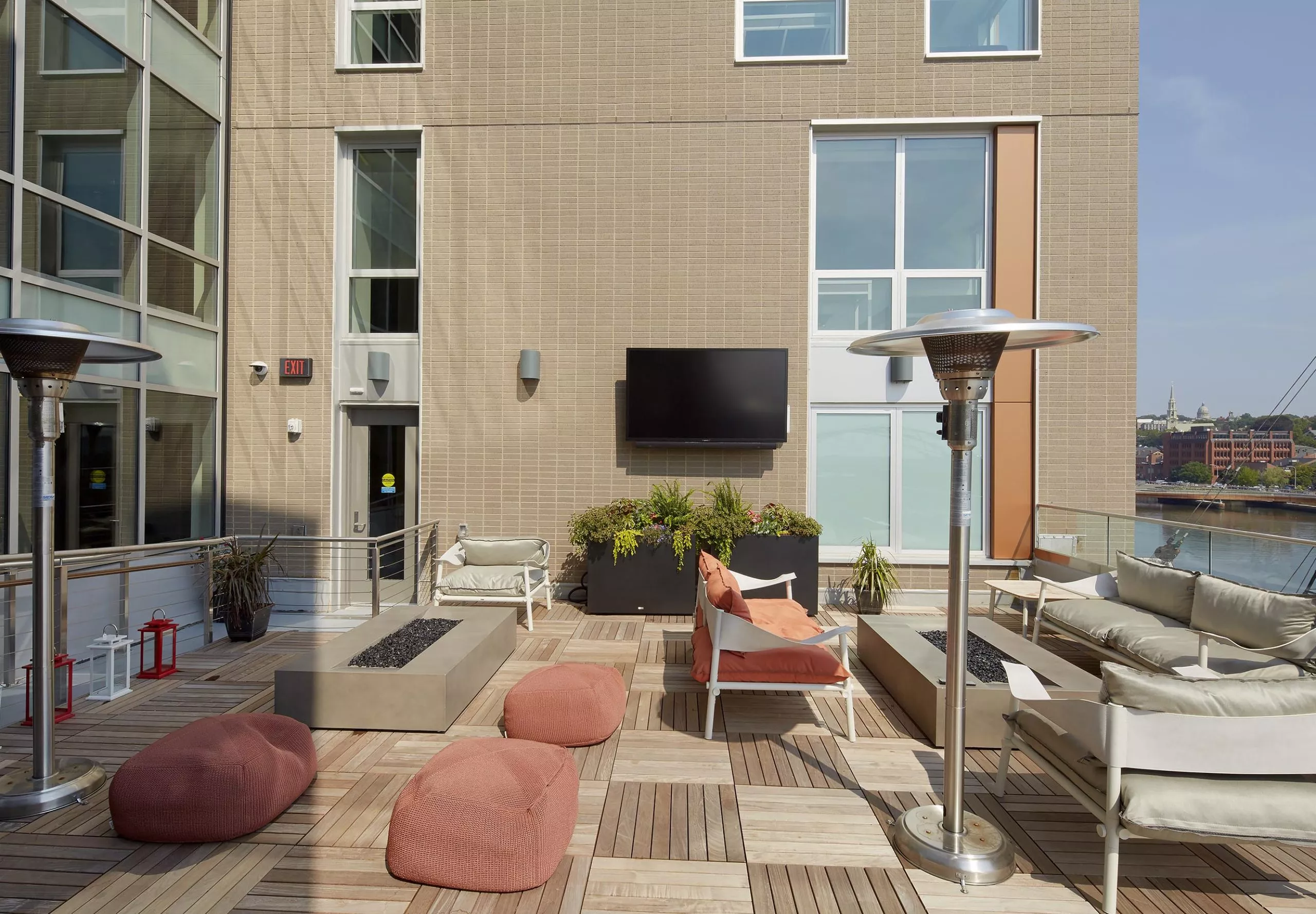 Balcony and outdoor seating area at River House Apartments