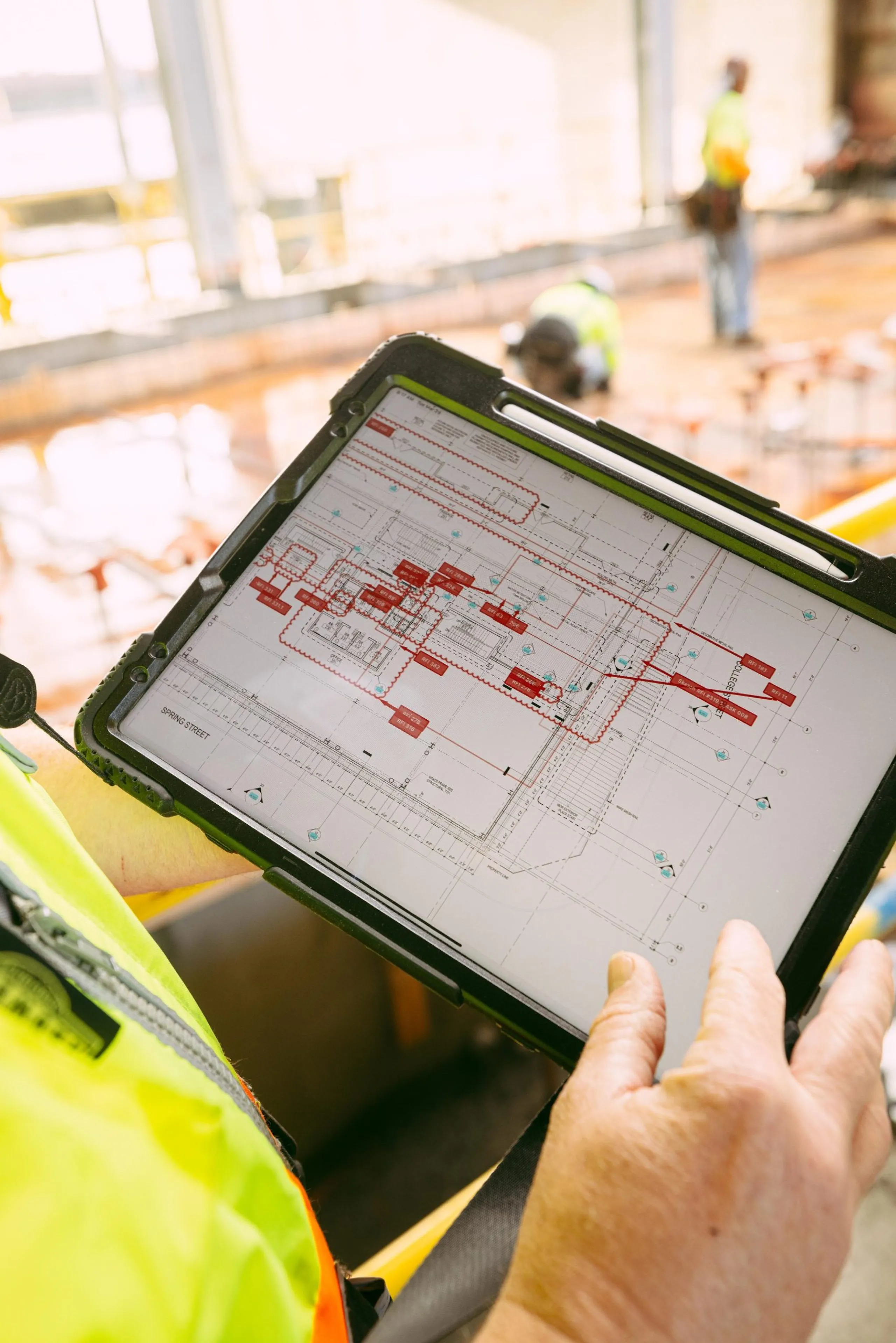 Person using tablet with schematics