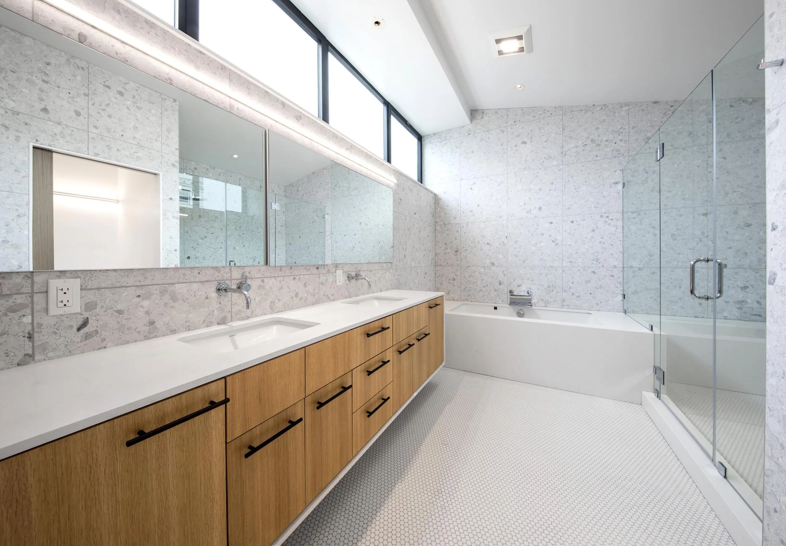 Interior view of a bathroom with bathtub, shower, and sink