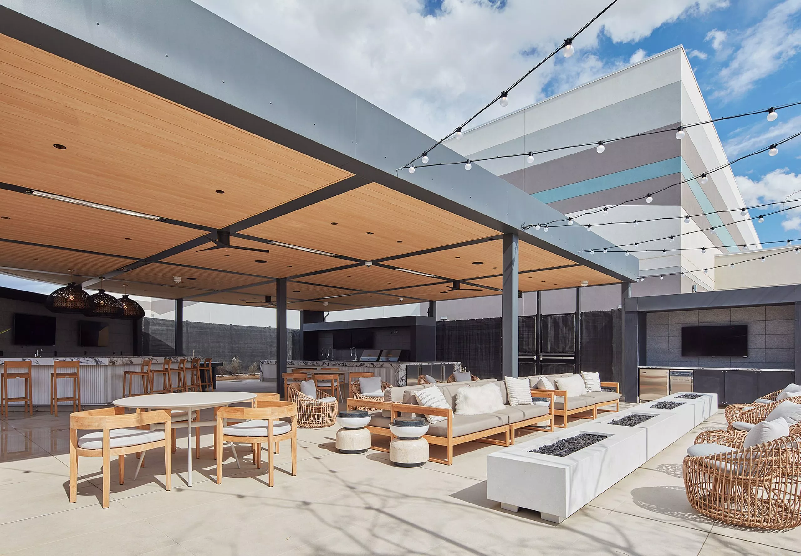 Outdoor seating area, firepit and bar at Acrisure Arena