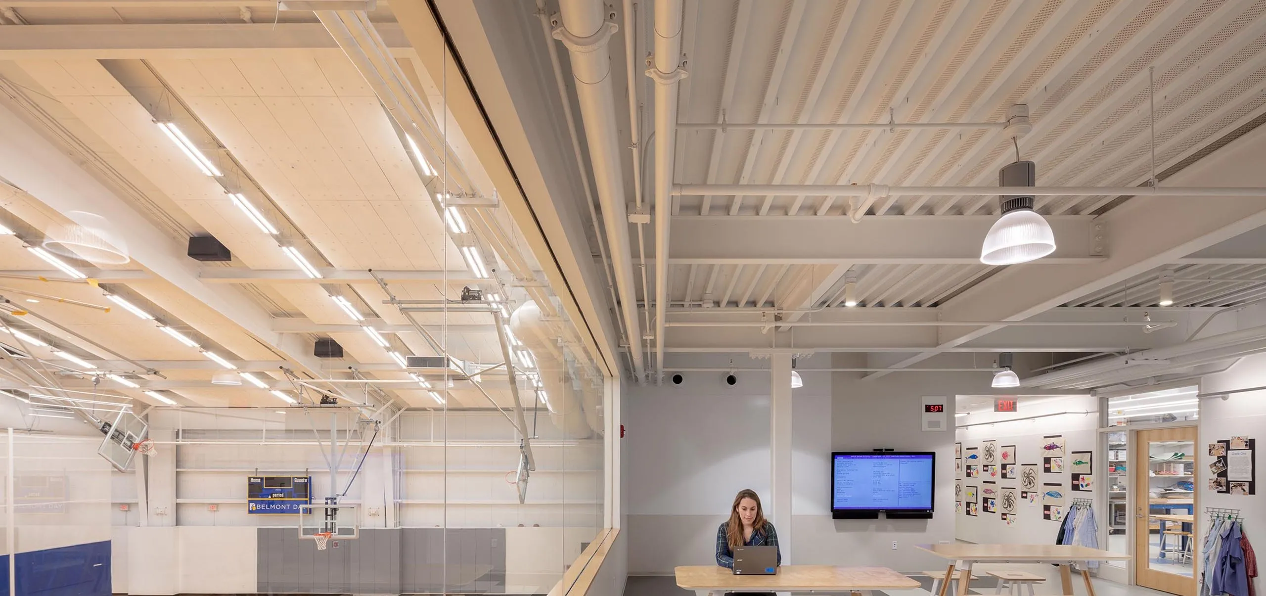 Gym and classroom connected by glass window at Belmont Day School