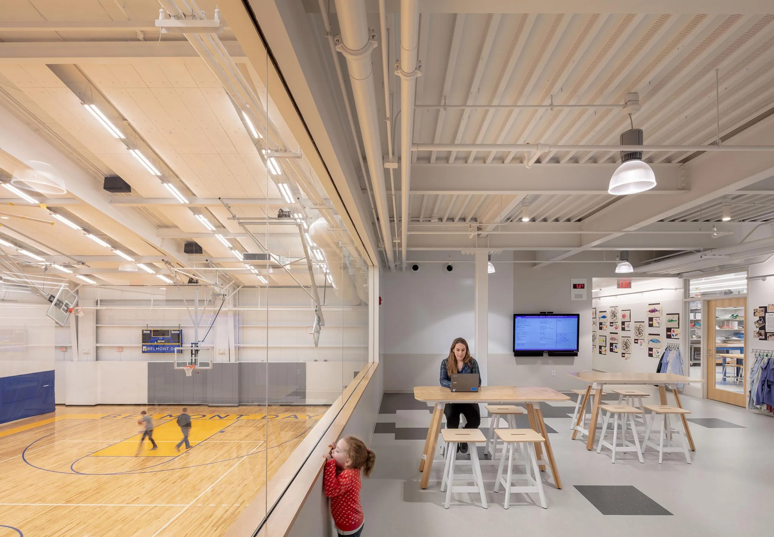 Gym and classroom connected by glass window at Belmont Day School