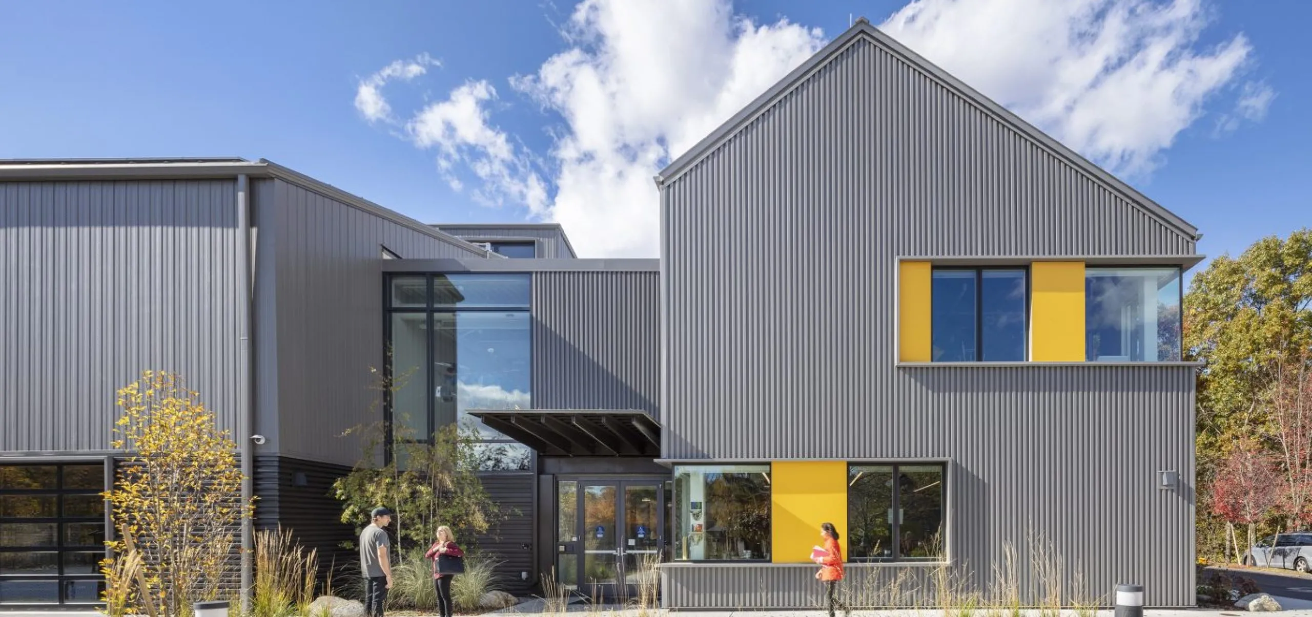 exterior view of the Belmont Day School barn with people out front