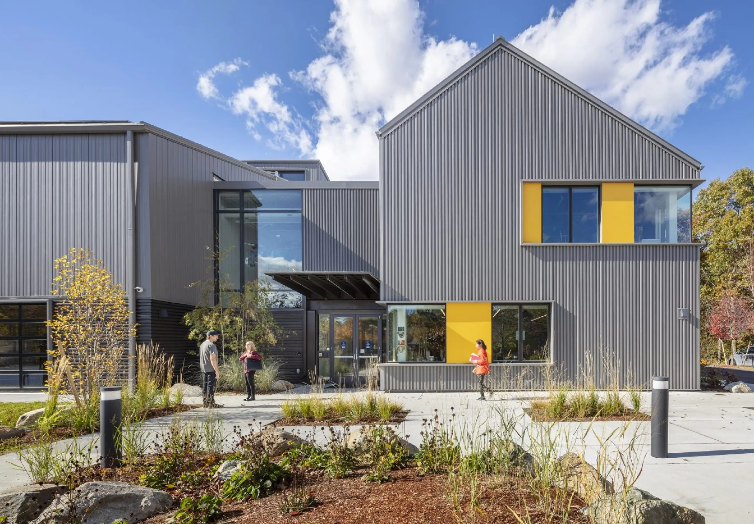 exterior view of the Belmont Day School barn with people out front