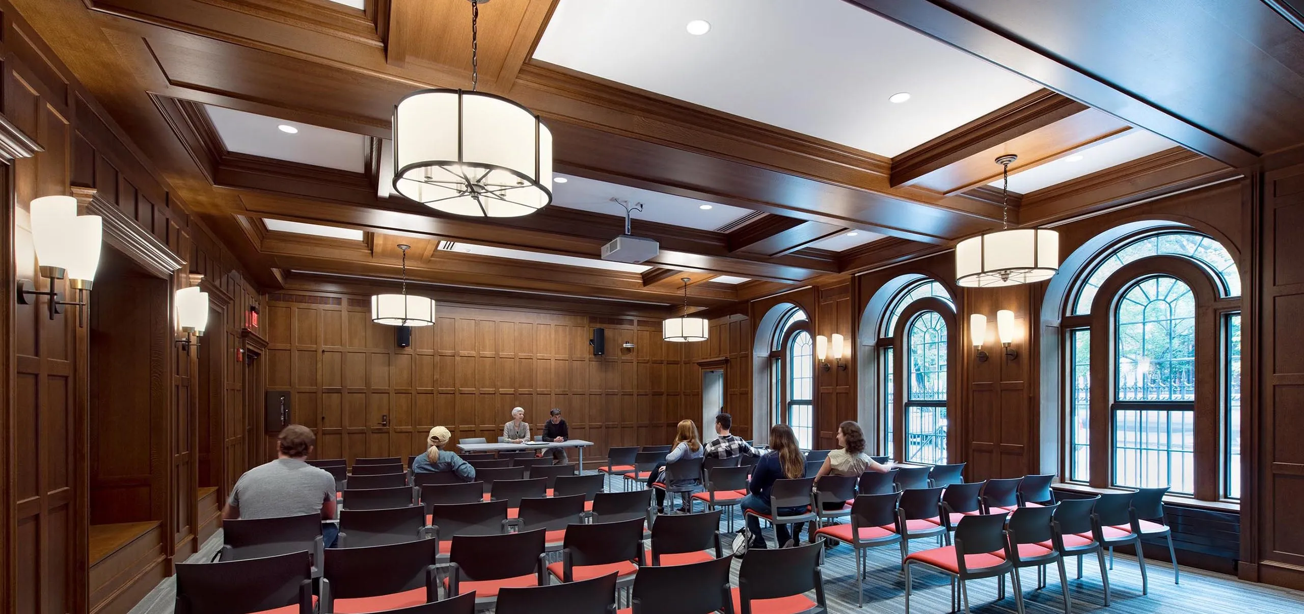 People in small auditorium room at Boston University 610 Beacon Street Dorms