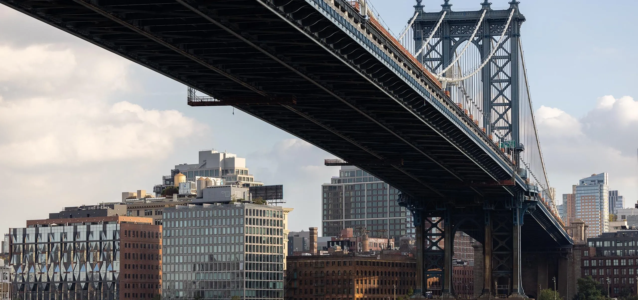 Brooklyn skyline and view of river and bridge with Adams Street Library visible in distance