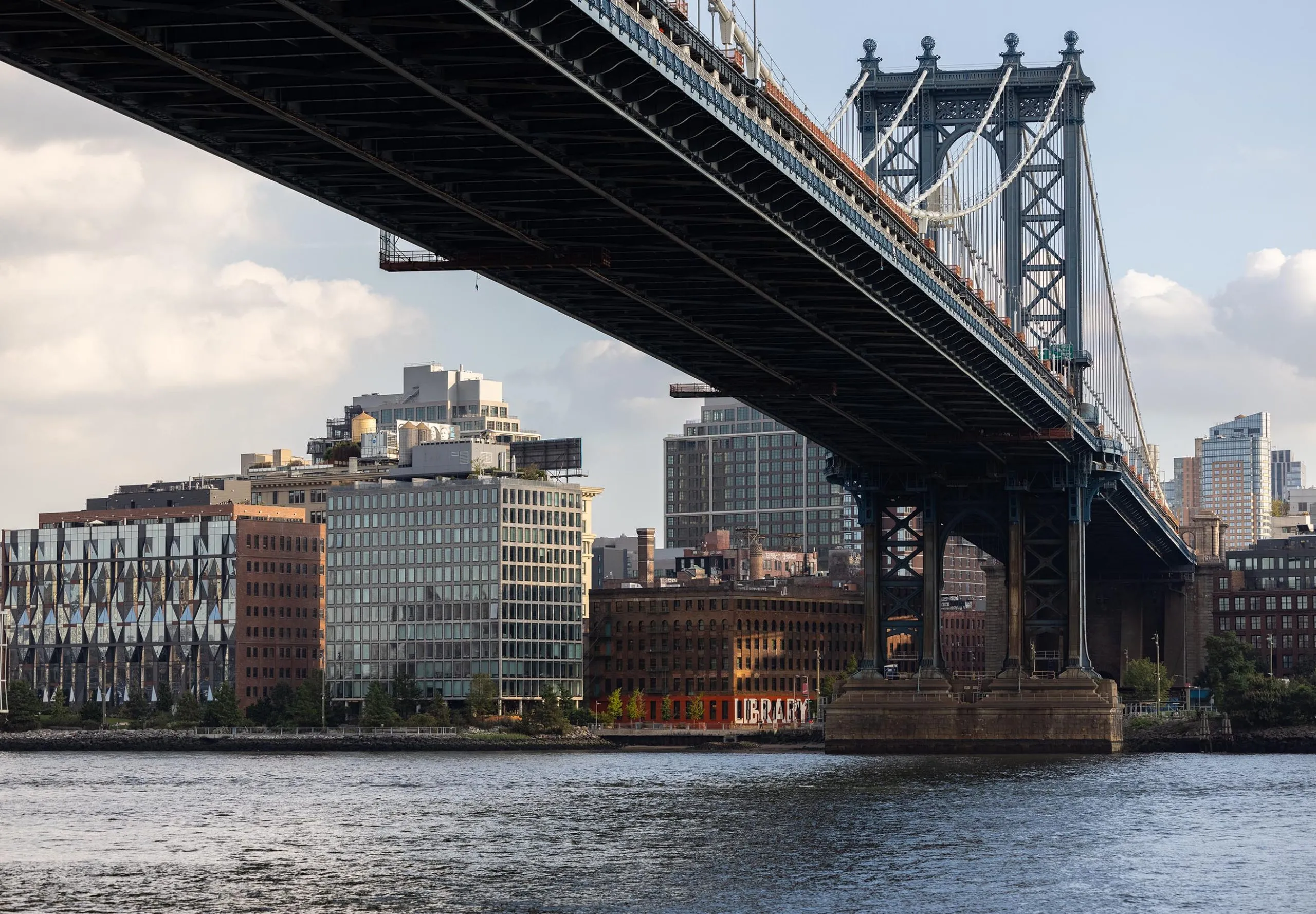 Brooklyn skyline and view of river and bridge with Adams Street Library visible in distance