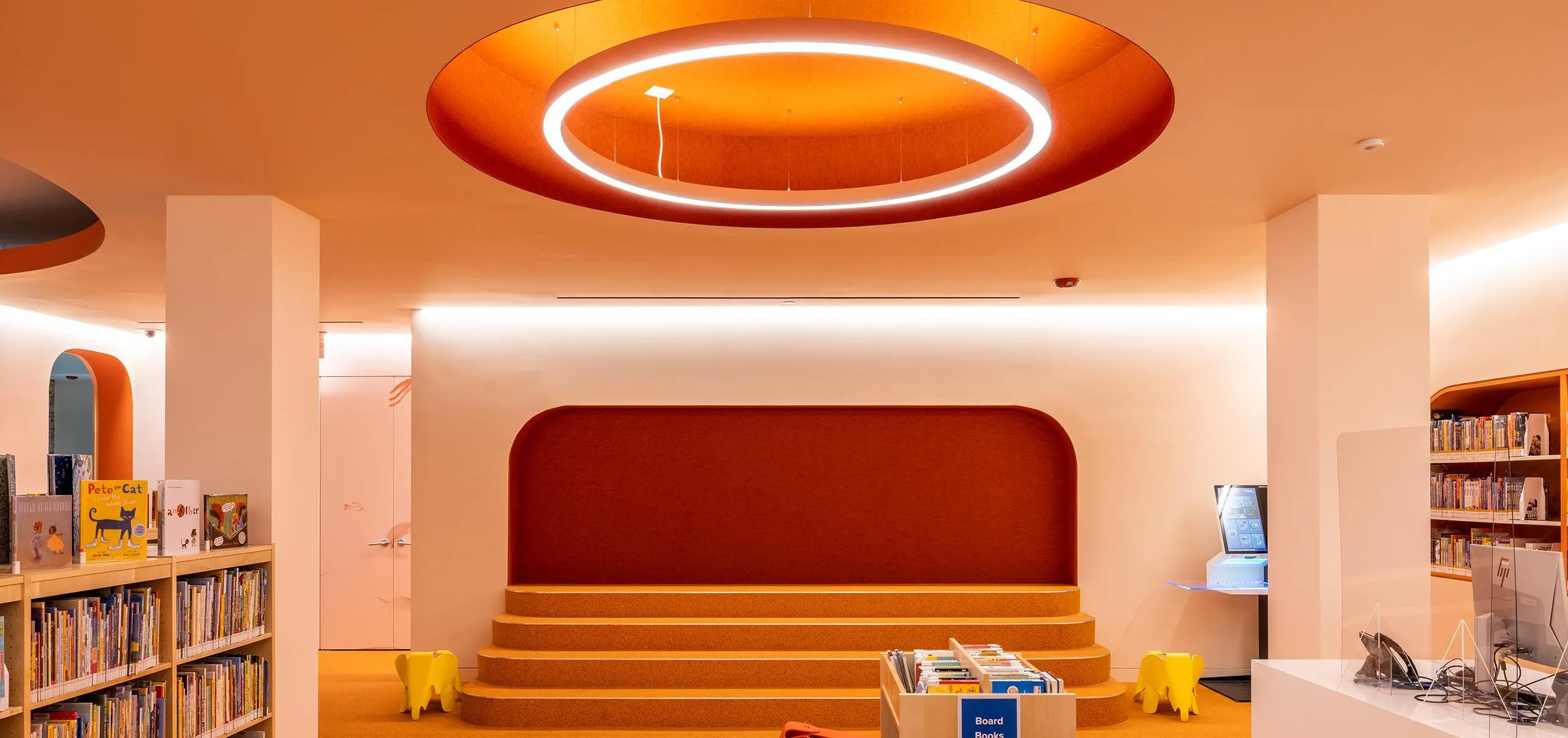 Children's room in Adams Street Library with brightly colored decorations and bookshelves