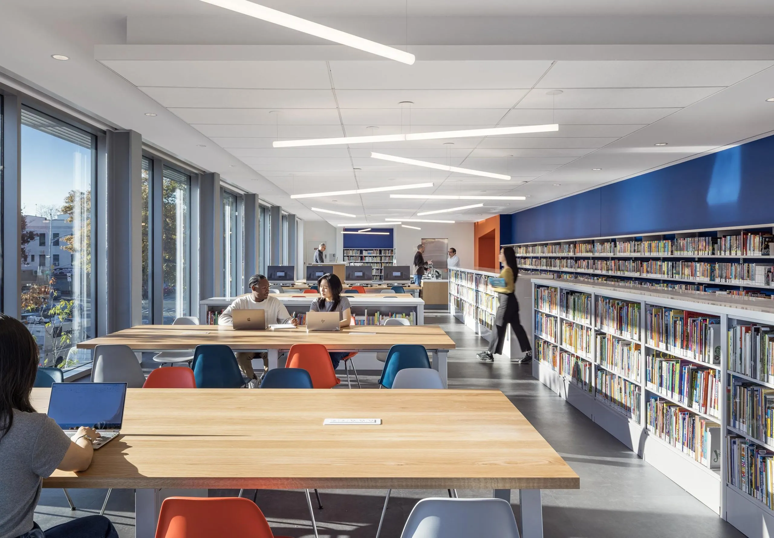 Tables and bookselves at Sunset Park Library