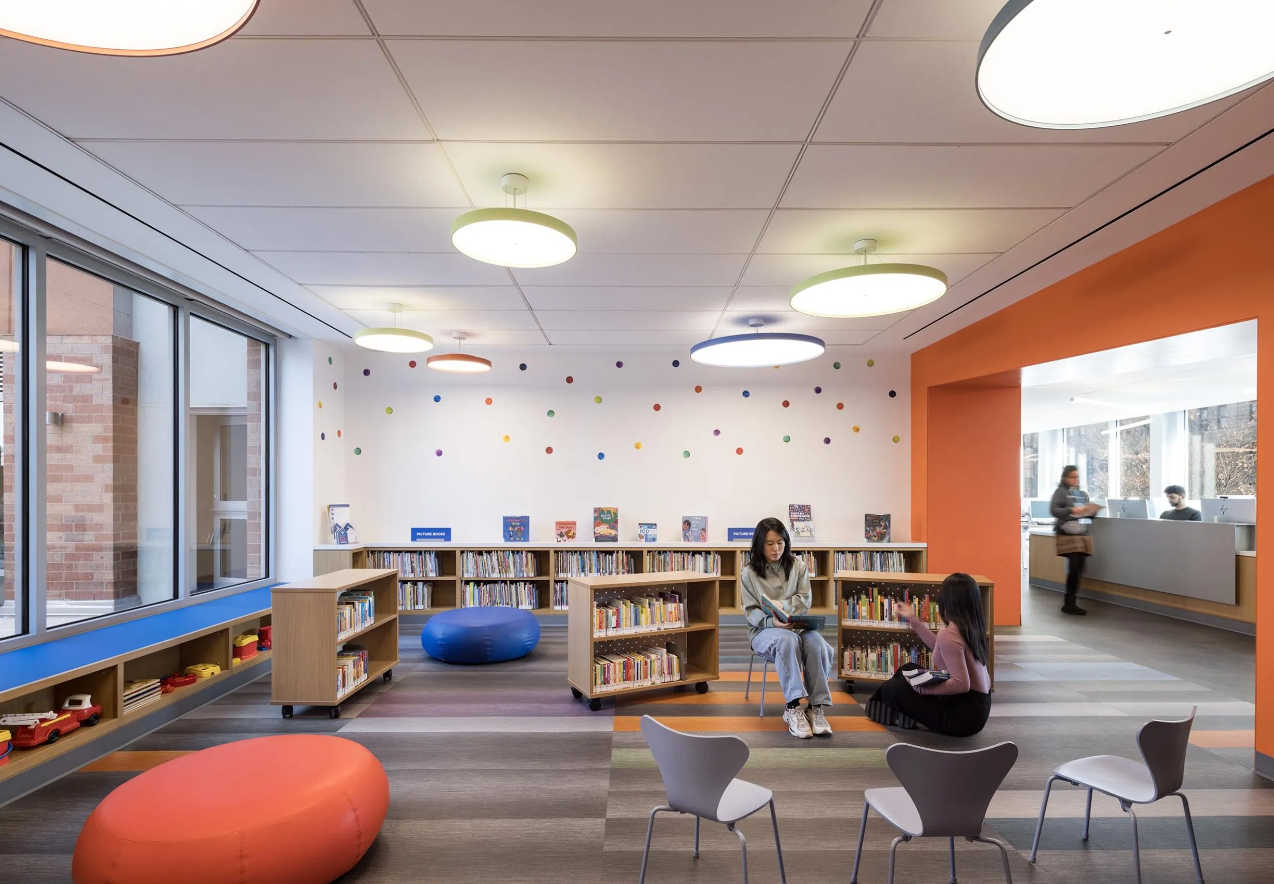 Children's area with toys and bookshelves at Sunset Park Library