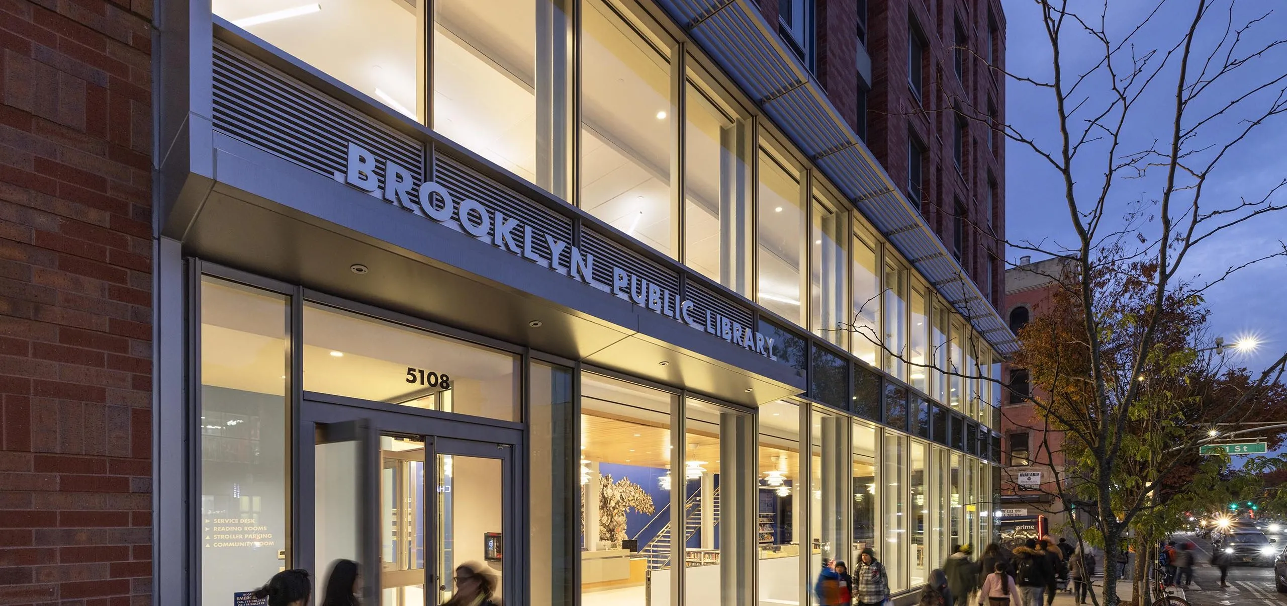 Outdoor street view of entryway to Sunset Park Library