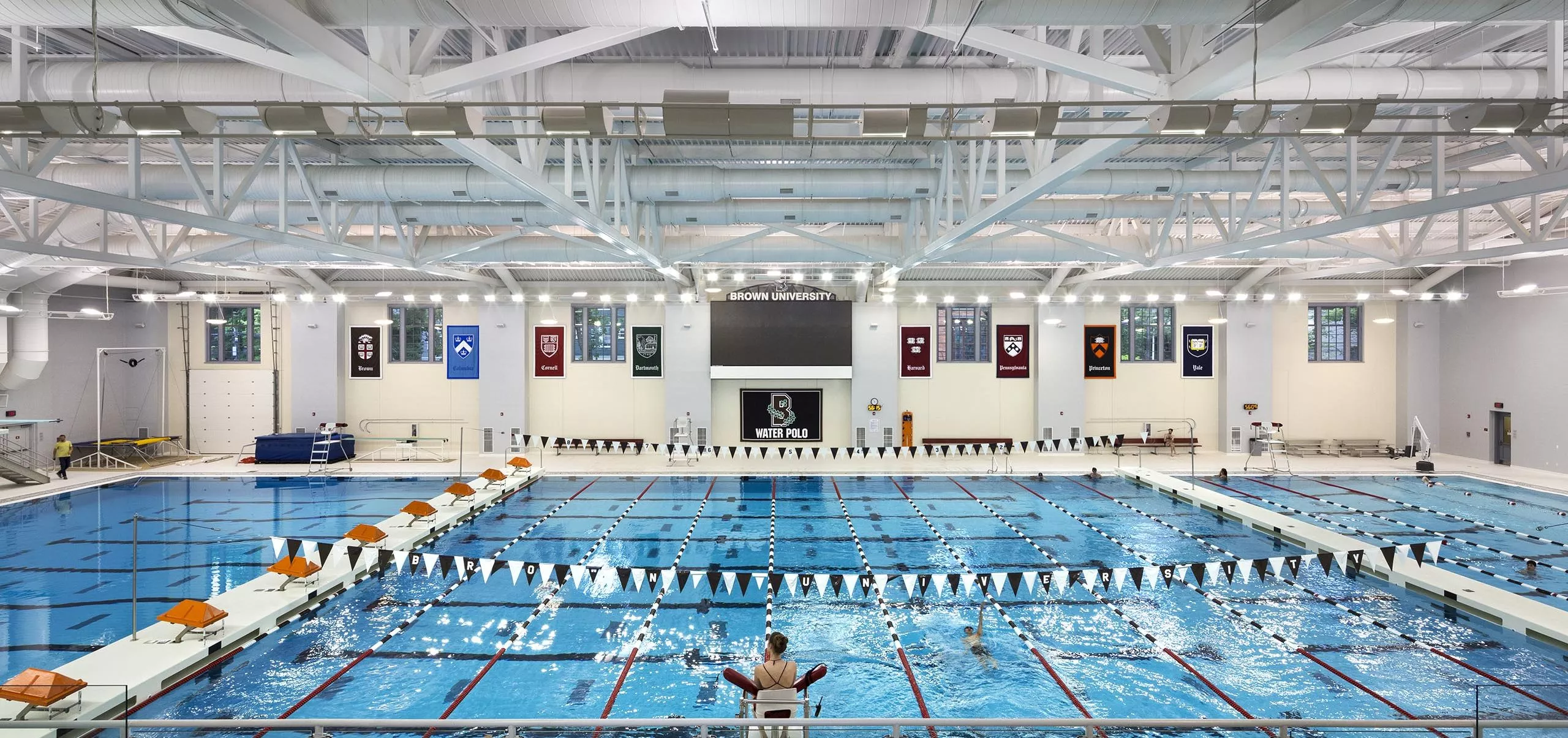 People swimming in pool inside Nelson Fitness & Coleman Aquatics Center