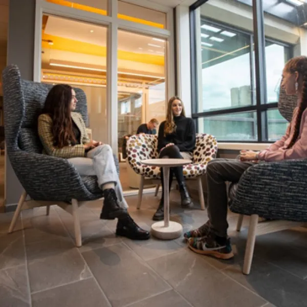 Students sitting around a small table at Brown University Sharpe House