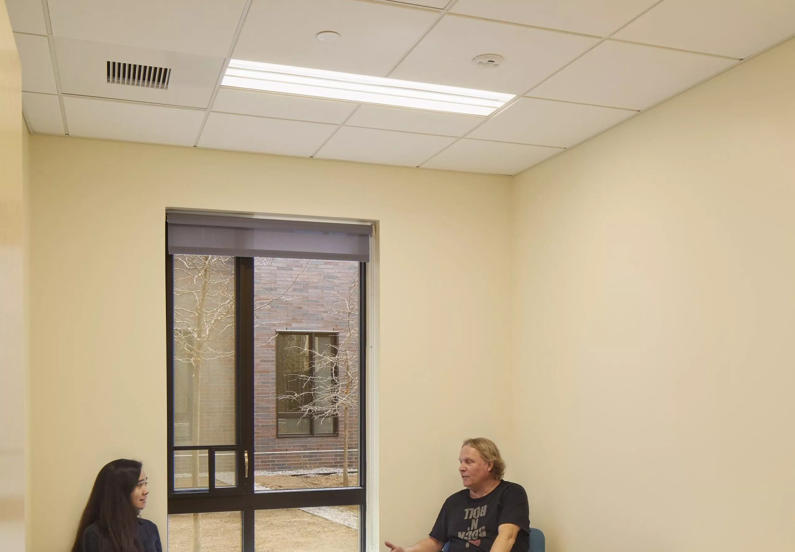 Two people meeting inside small meeting room in Sternlicht Residential Commons and Health & Wellness Center