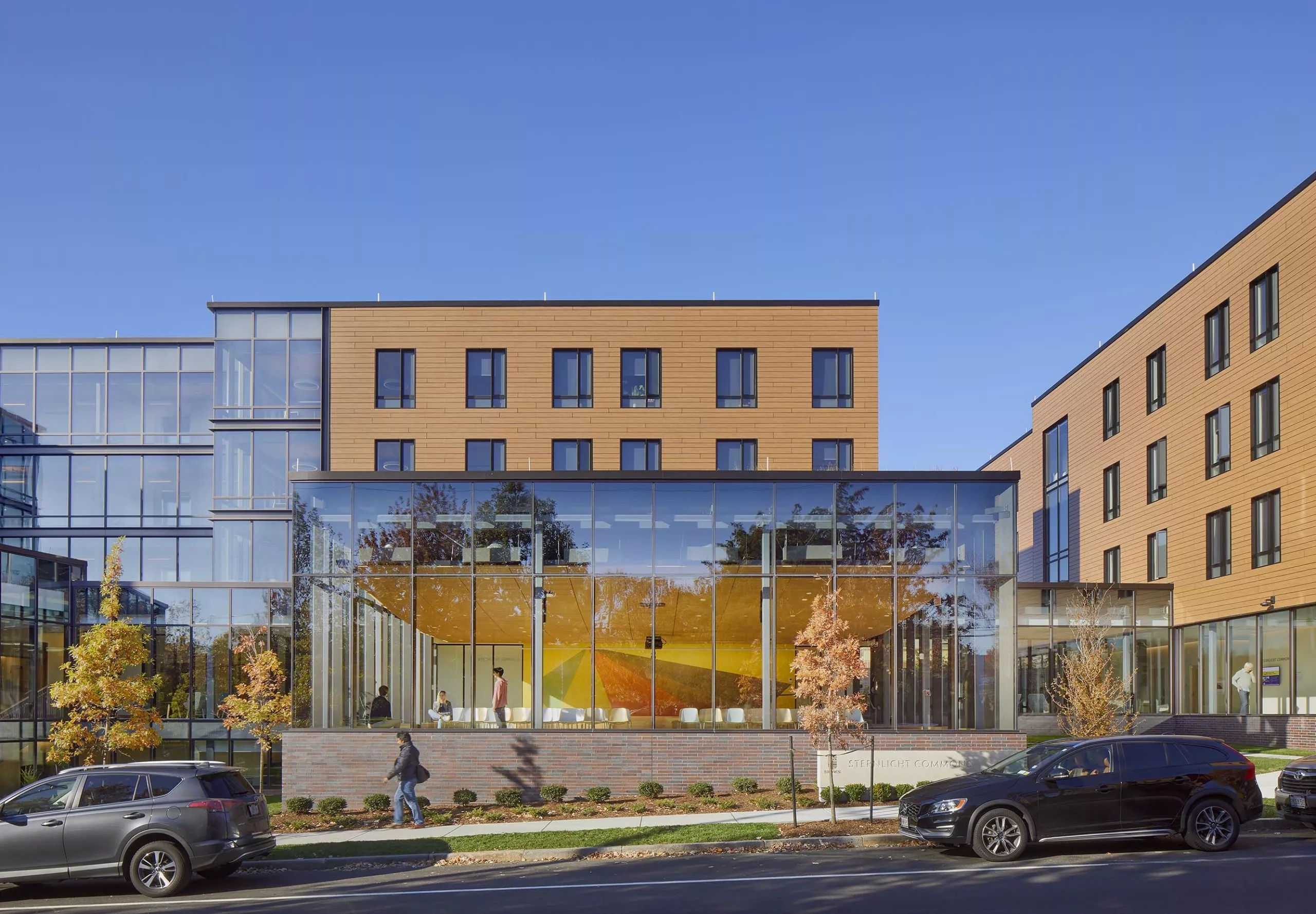 Street view of Sternlicht Residential Commons and Health & Wellness Center with large windows