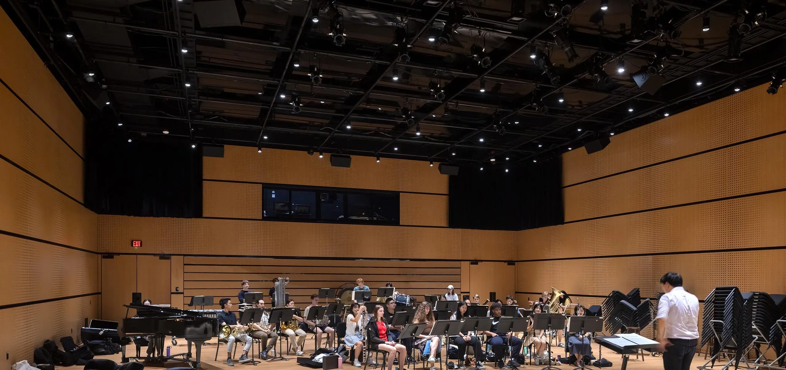 Orchestra practicing inside Lindemann Performing Arts Center