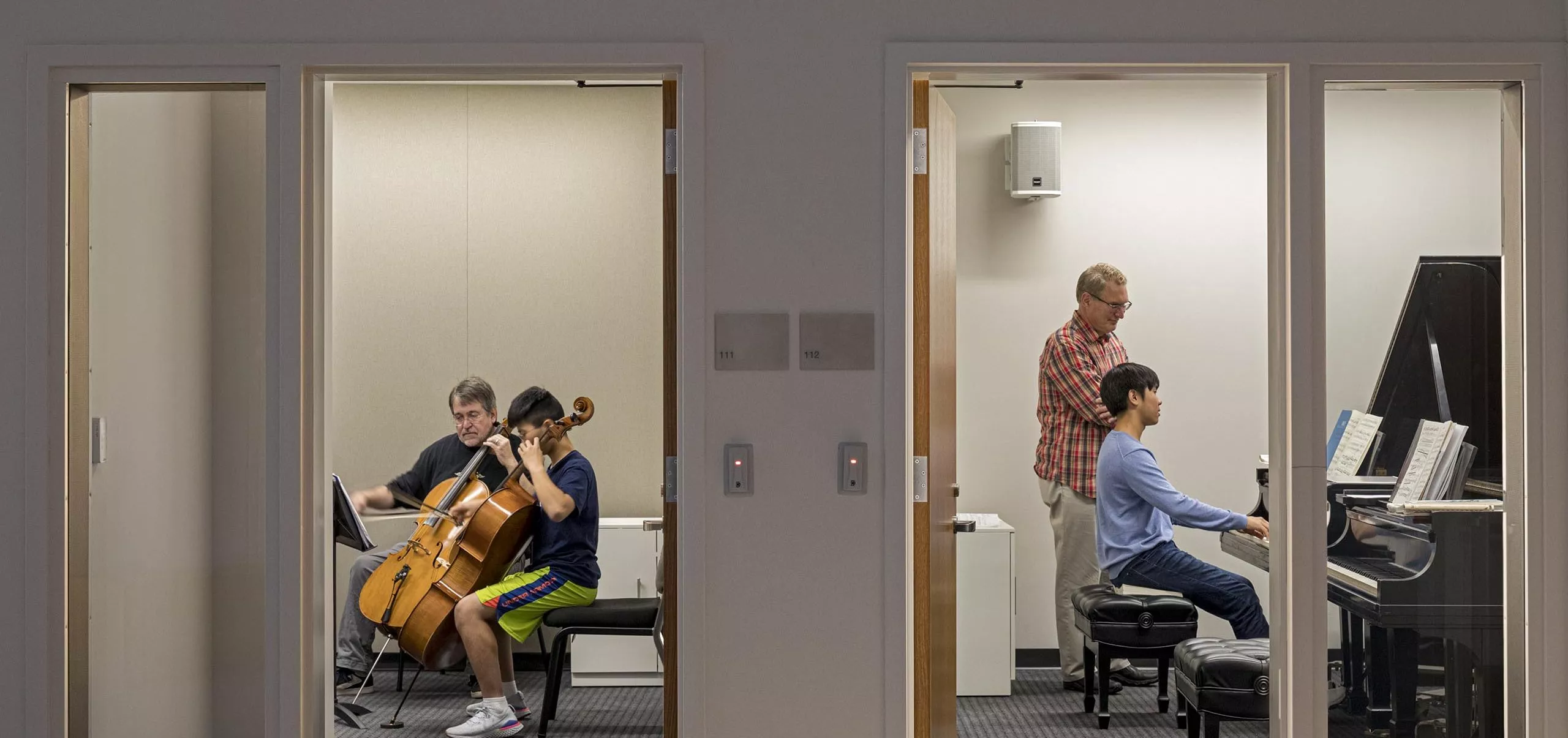 Students practicing instruments in private rooms in George Colony Hall