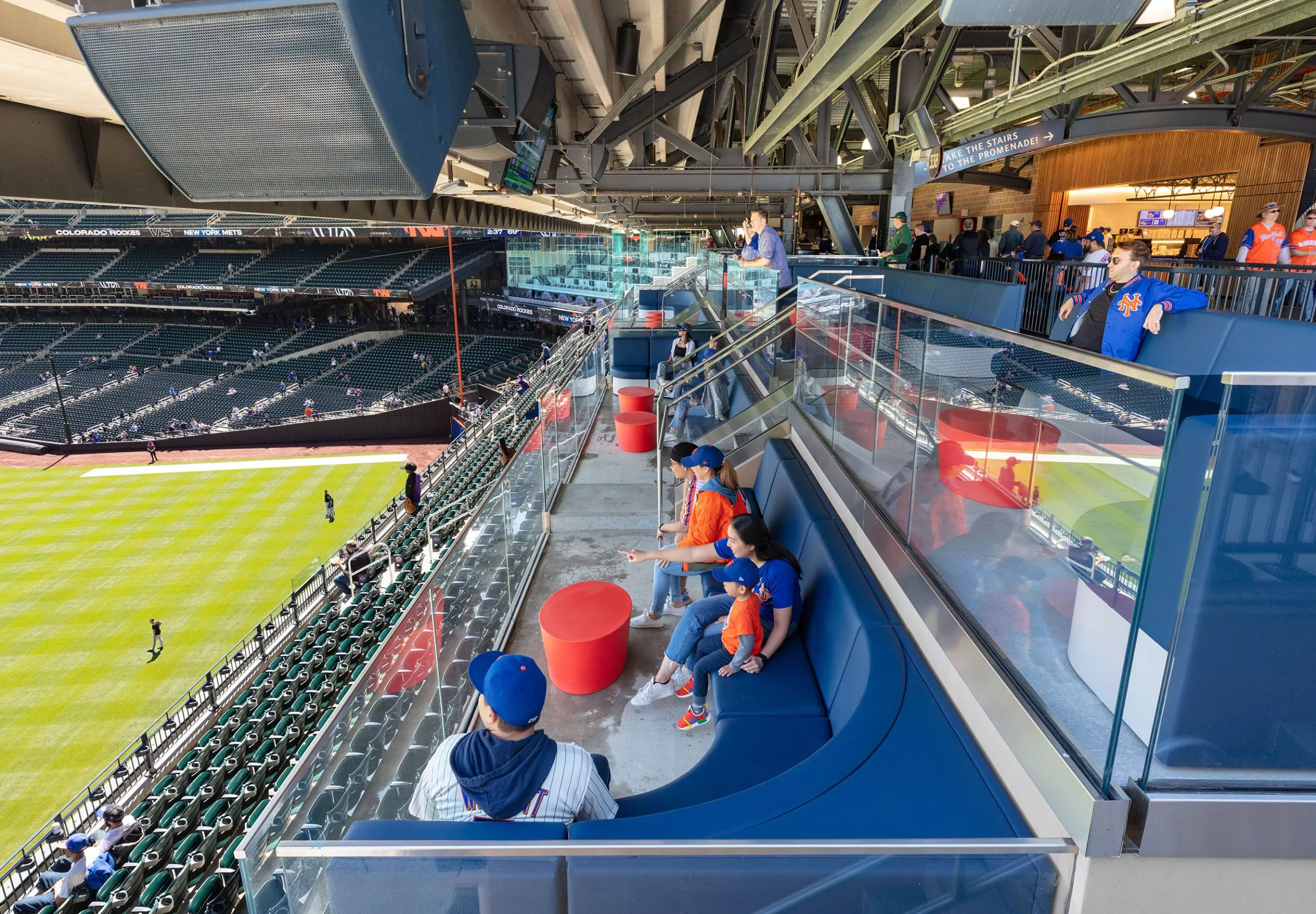 People in couches watching baseball game at Citi Field Stadium