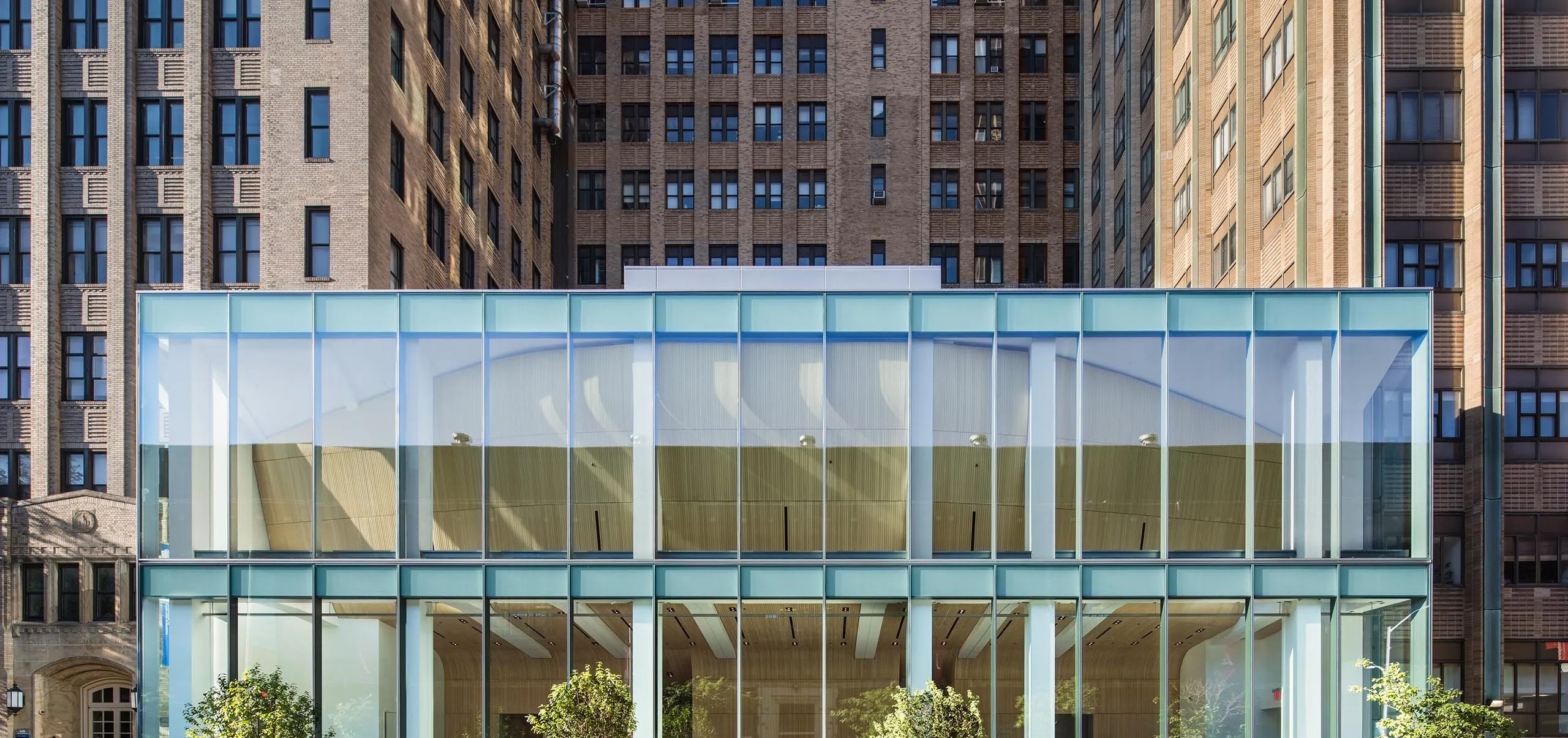 Glass entryway and exterior of Columbia University Alumni Auditorium