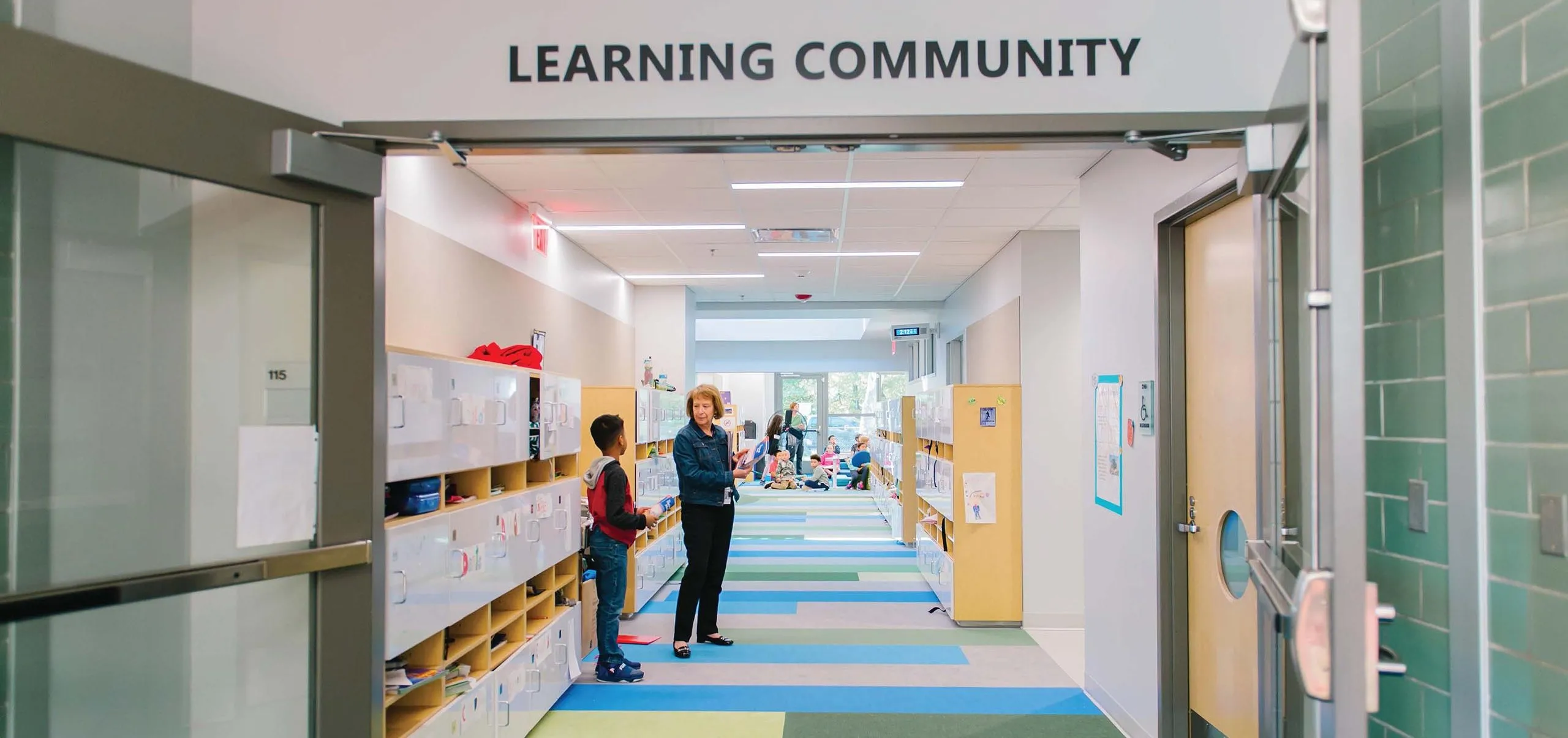 Hallway of Eden Park Elementary School with colorful striped carpeted floors